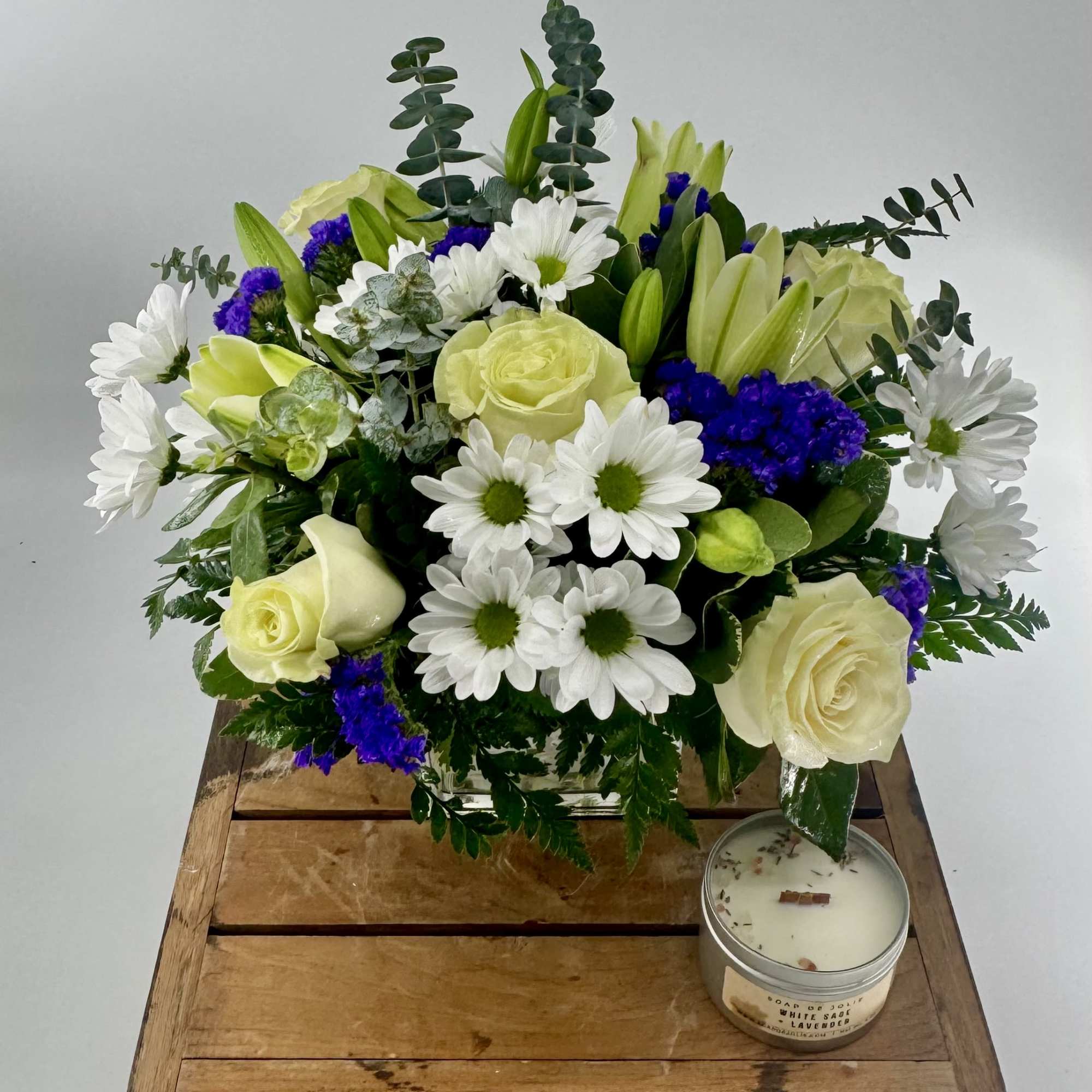 Capture the essence of elegance with our exquisite floral arrangement in a