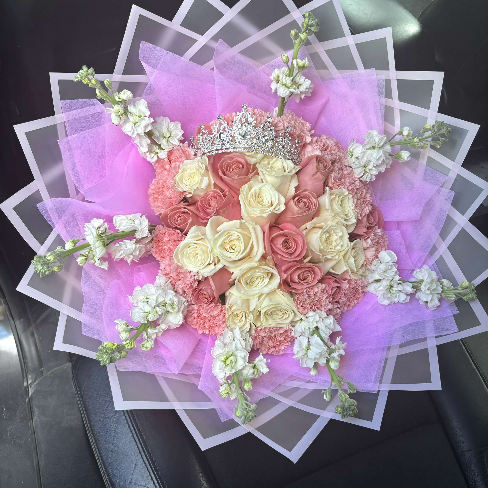 Pink and cream rose bouquet with a silver tiara and lavender wrap