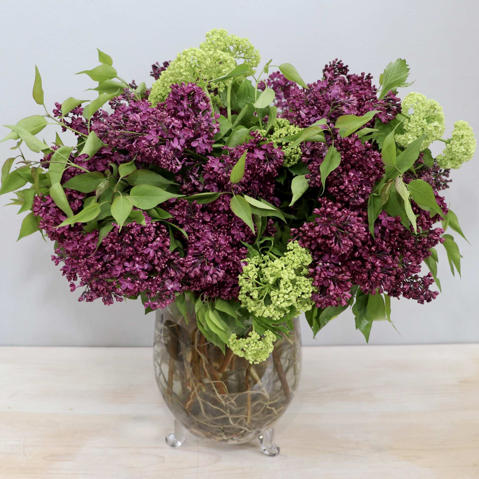 Lilac season is almost over, don't miss out! This arrangement mixes purple
