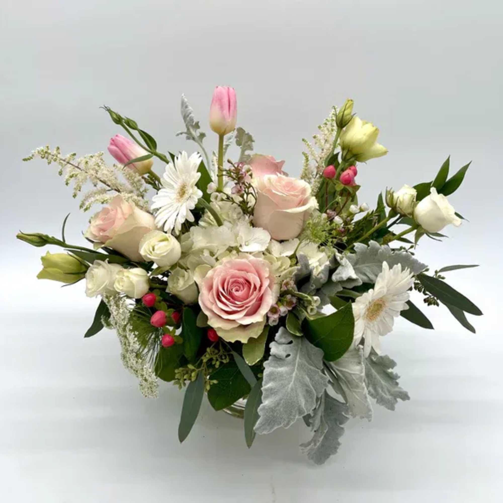 Low and lush, soft pastel arrangement in a 5 x 5 vase