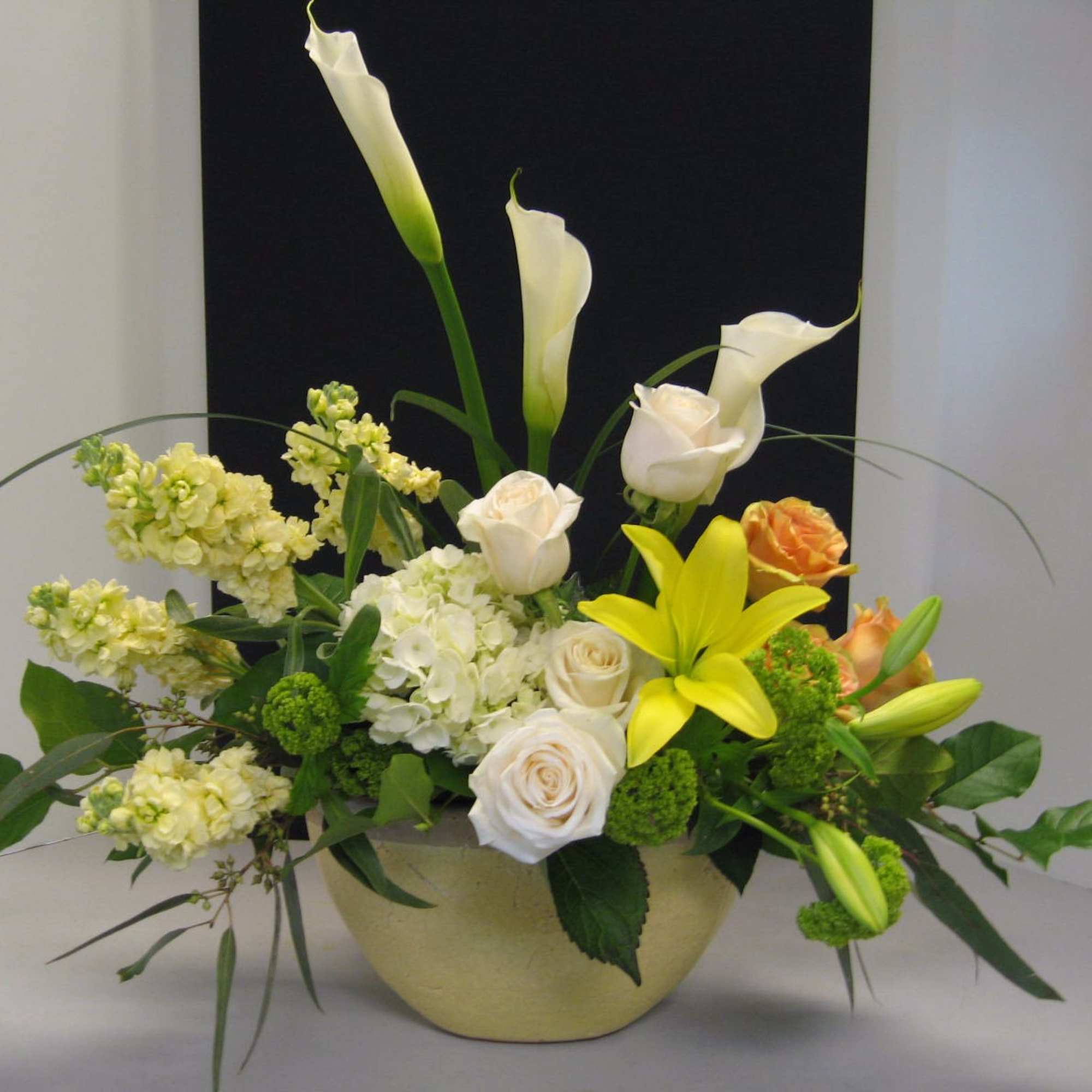White Calla Lilies,White Roses Yellow Asiatic Lilies, White Hydrangea, Yellow Stock
Call Ahead