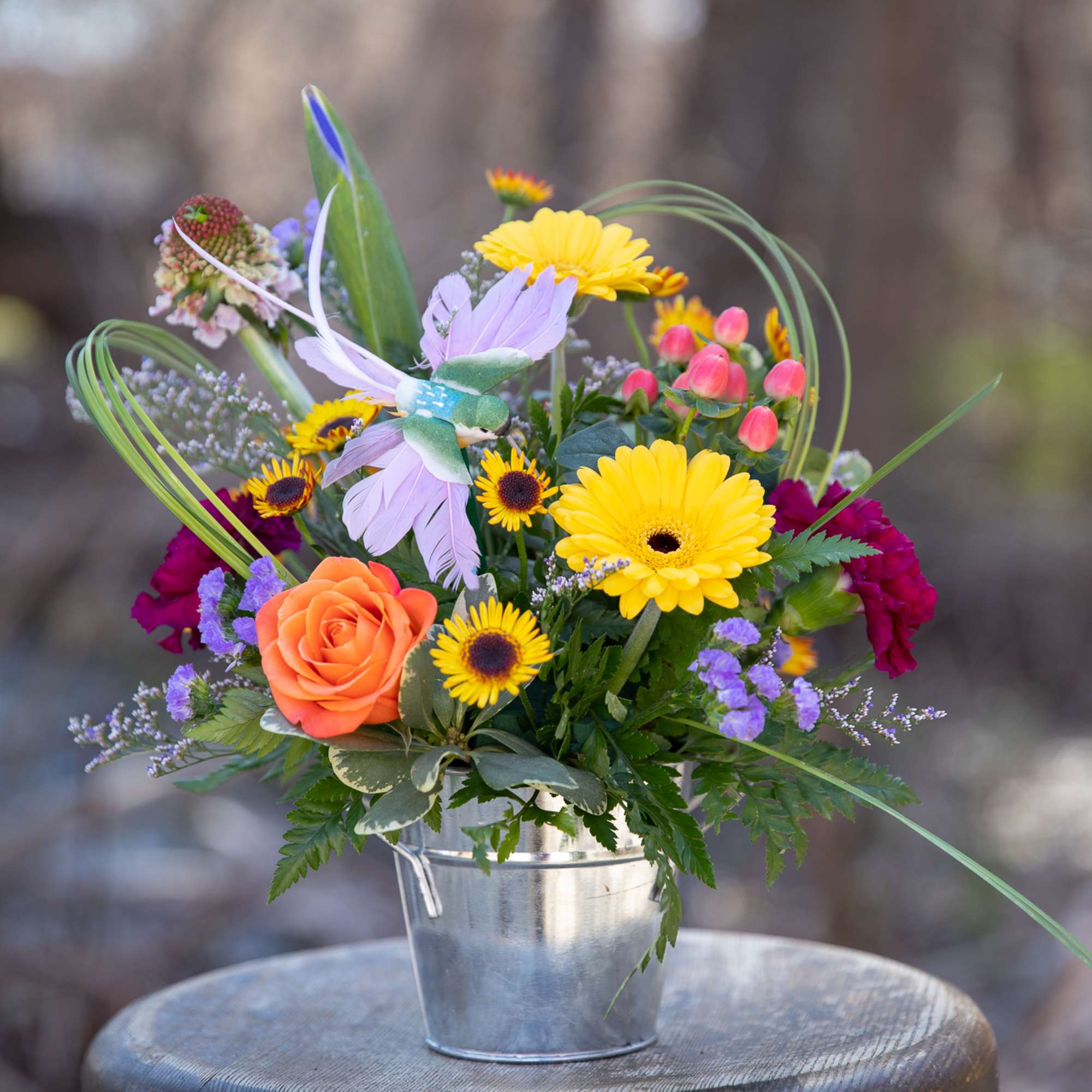 Colorful mixed bouquet in a metal bucket