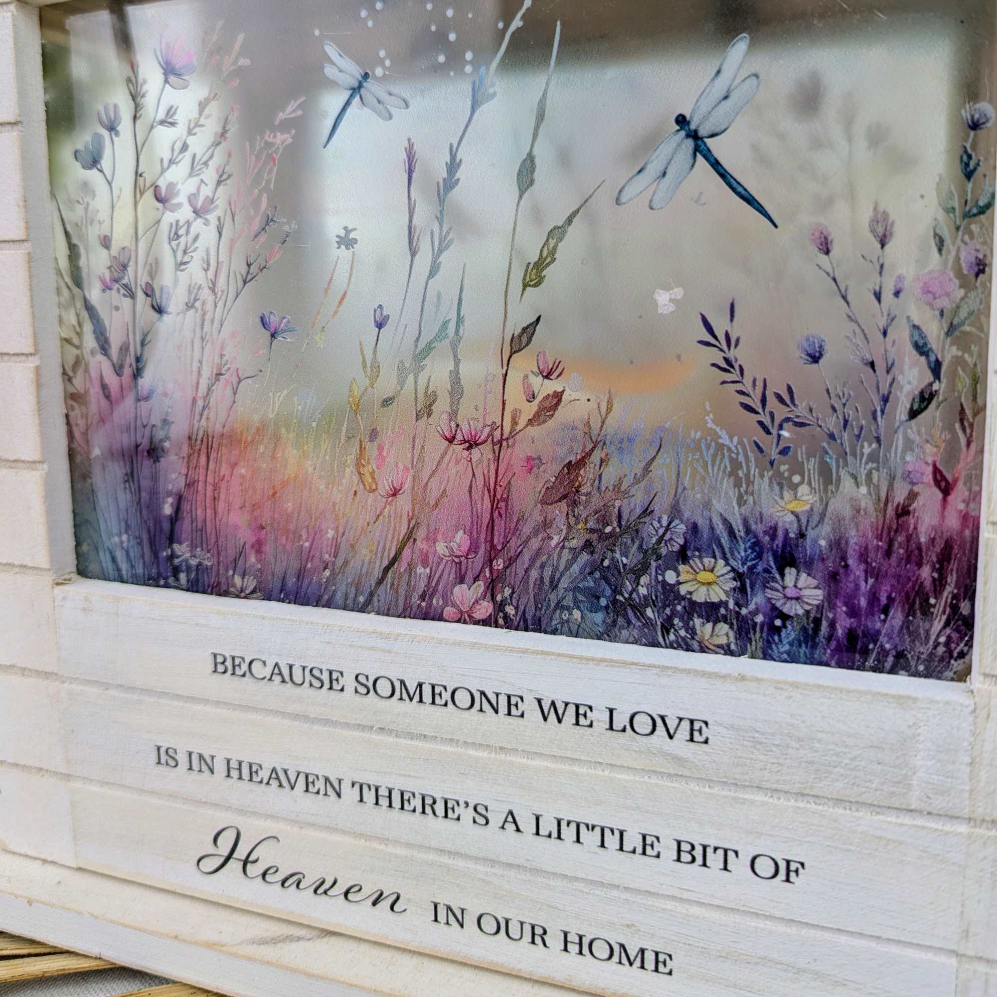Decorative sign with a watercolor meadow and memorial quote
