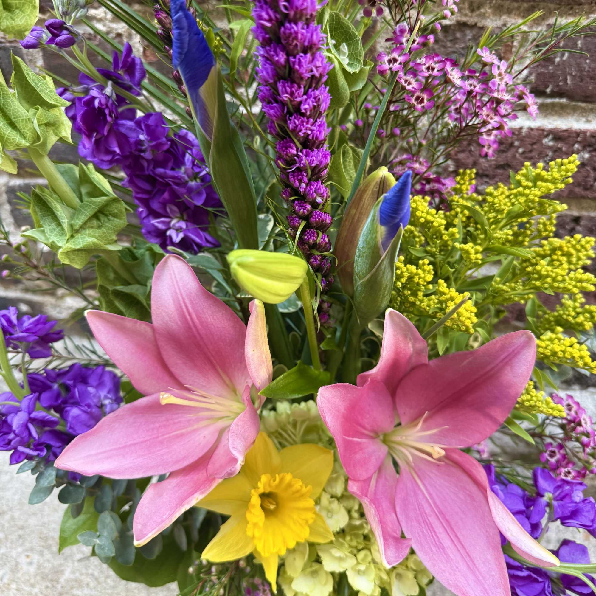 This stunning and unique arrangement showcases the Spring season with a burst
