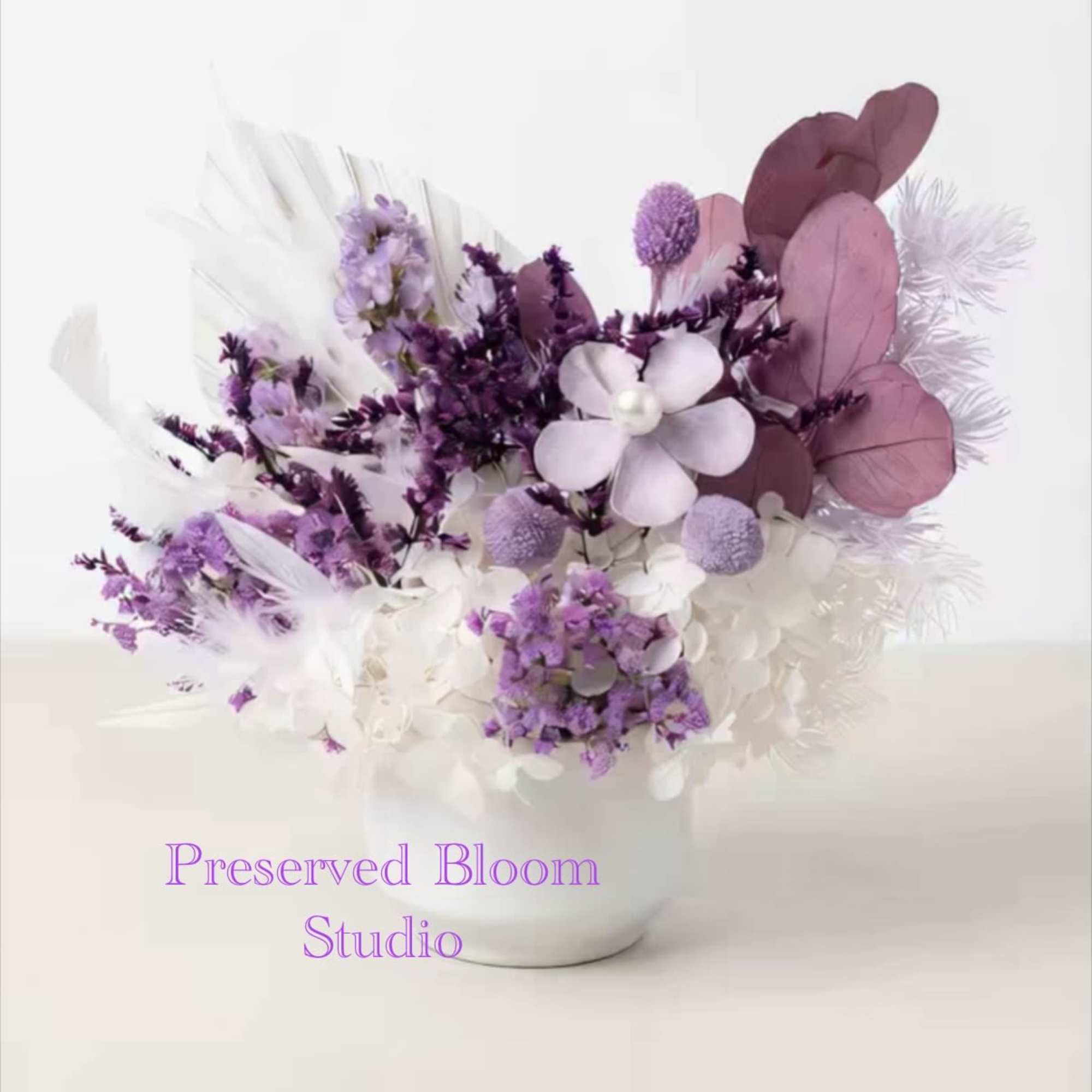 This is a purple and white flower arrangement, featuring its lasting characteristics