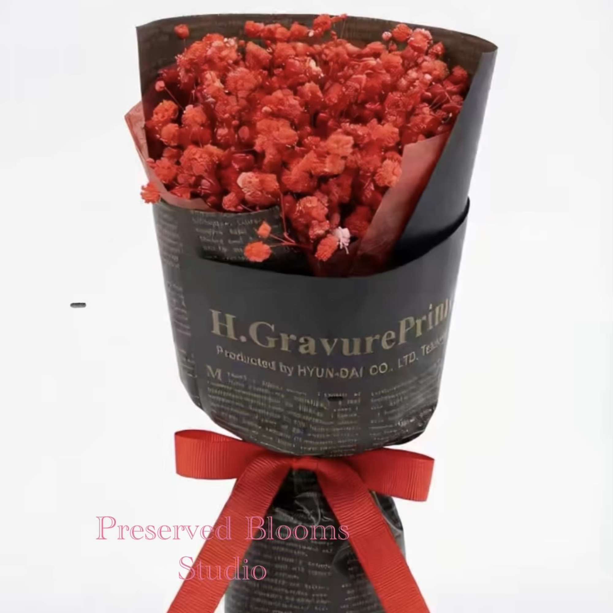 This is a small bouquet of dried flowers full of red stars.