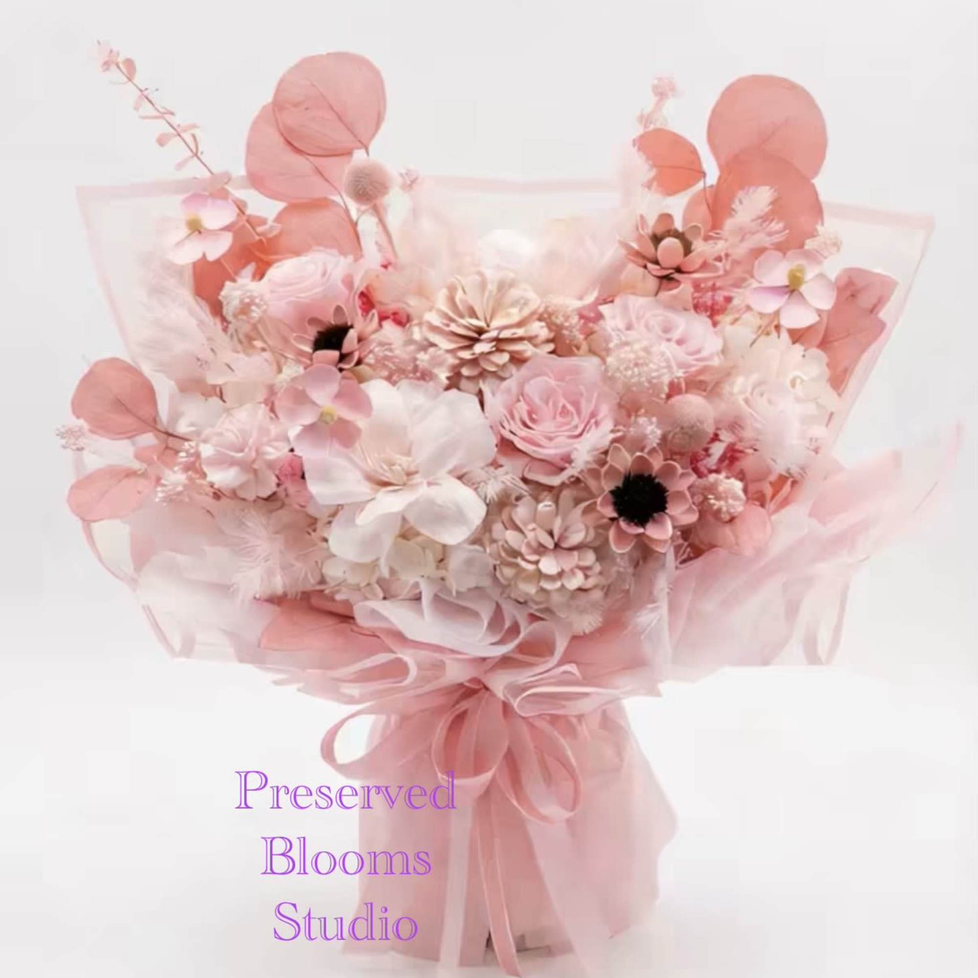 This is an immortal flower/dried flower bouquet with a soft pink tone.