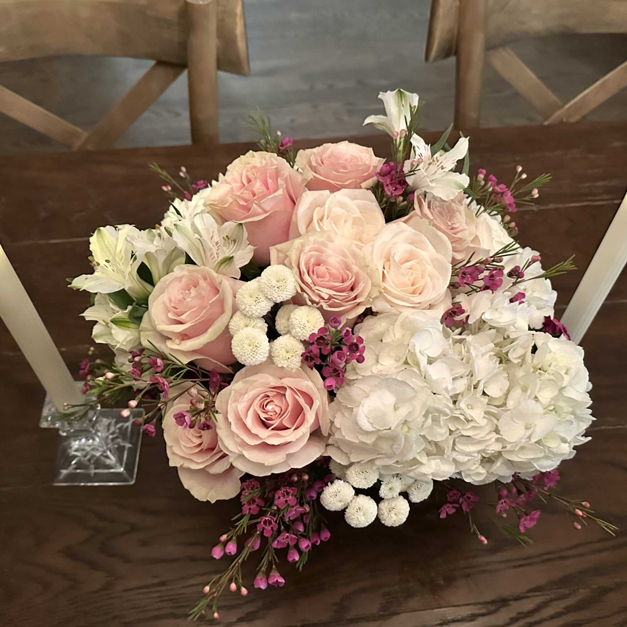 A light and lush arrangement perfect for a centerpiece or just because.