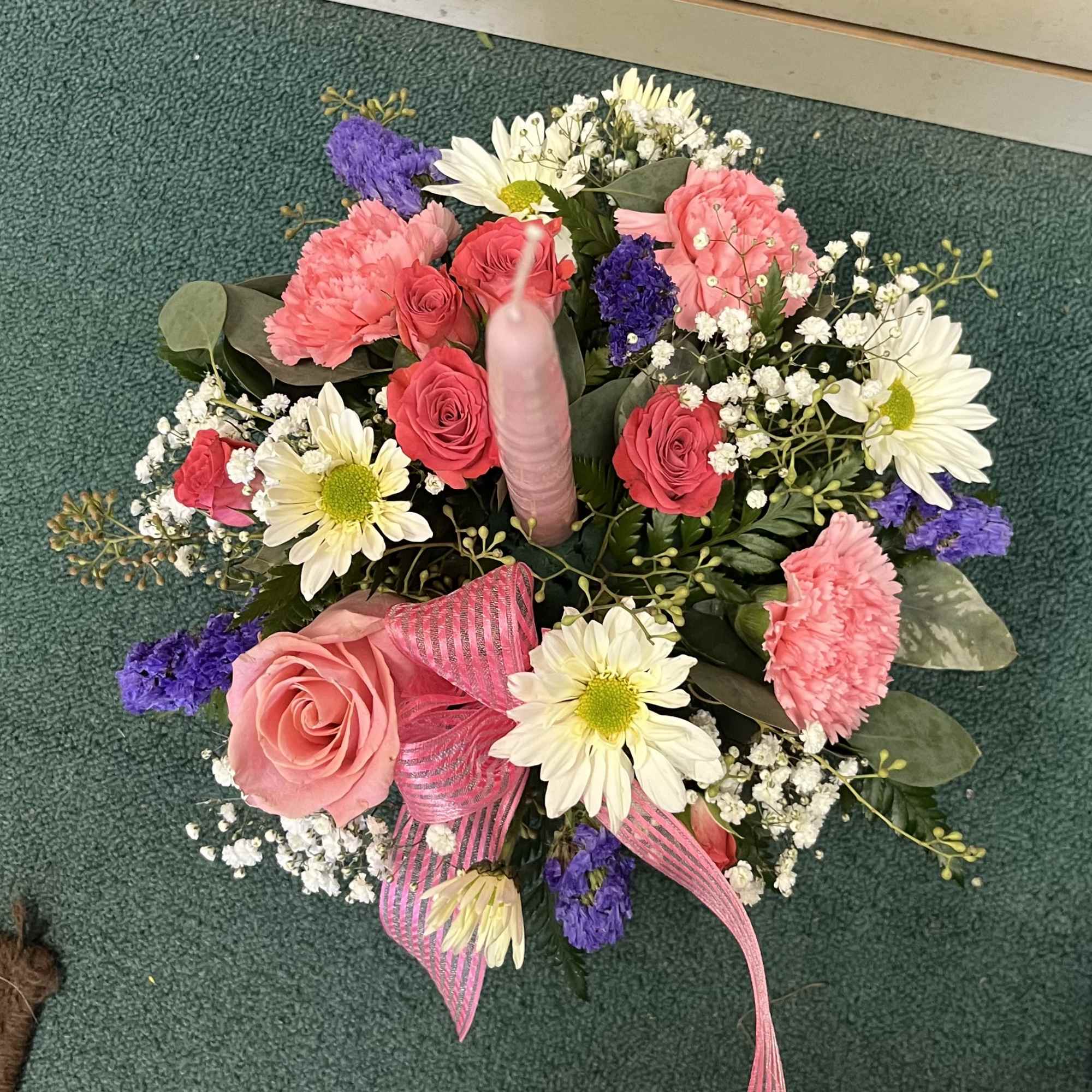 Rustic birch container with a (1)pink candle with pink white and purple