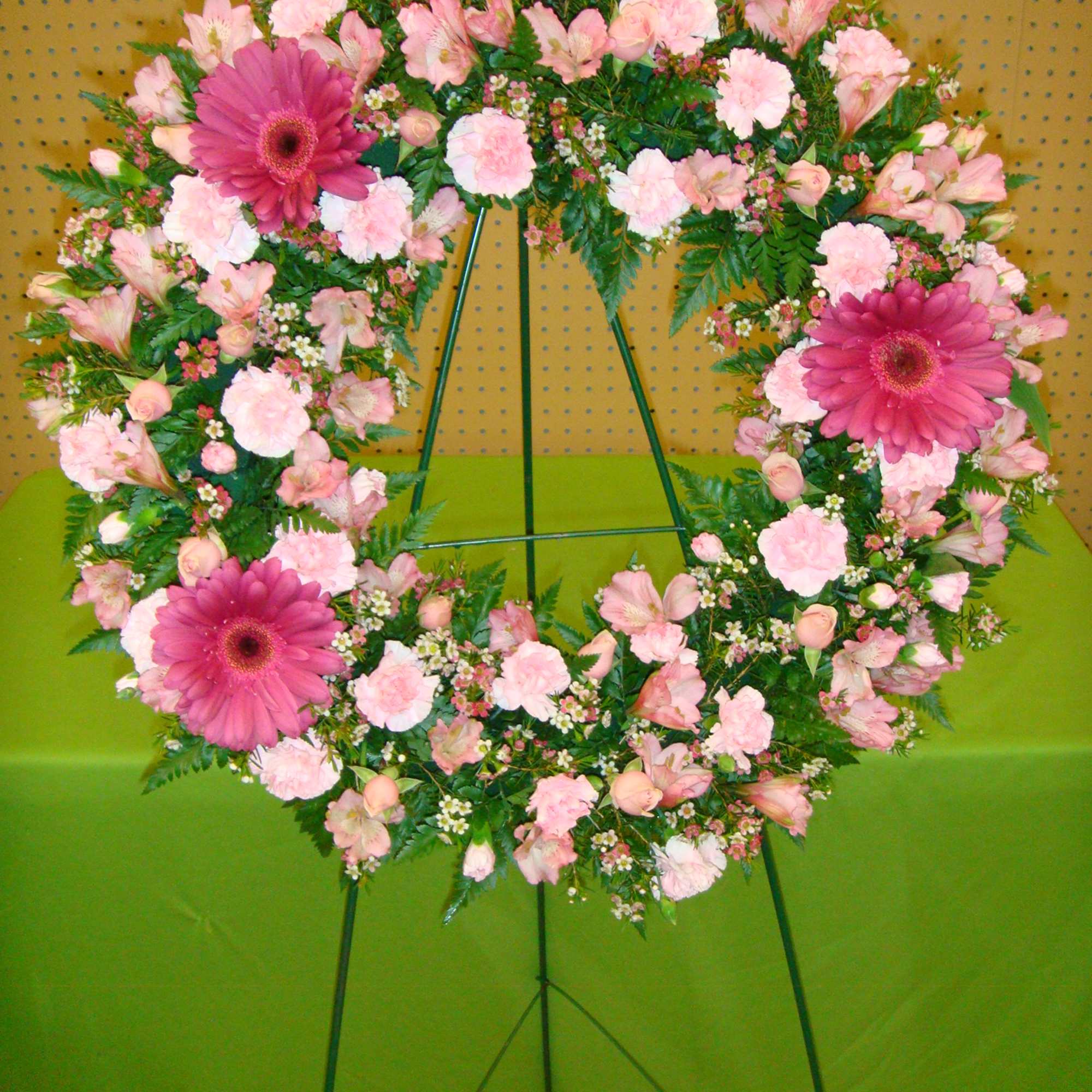 Pink floral wreath on a standing easel