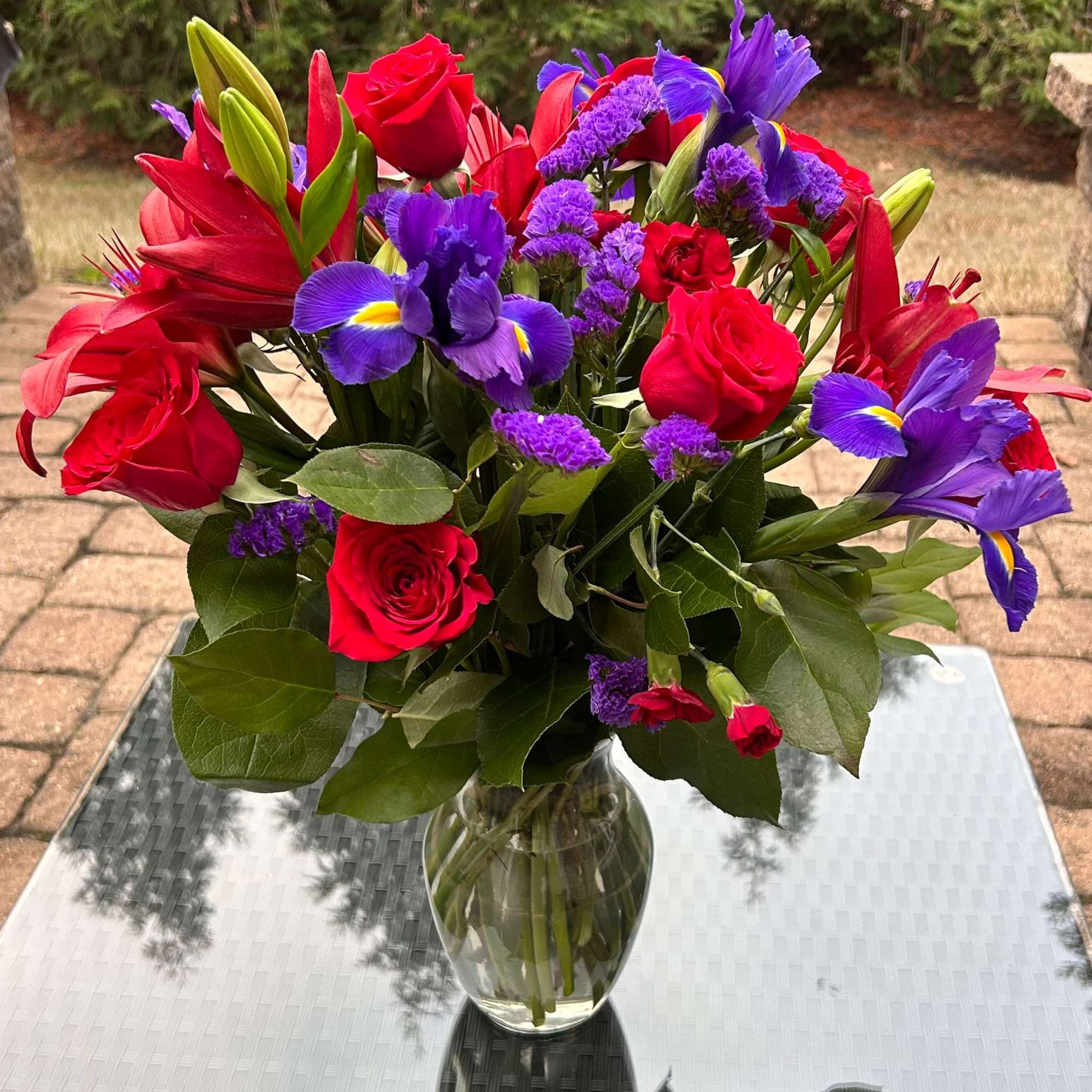 This dreamy jewel toned bouquet combines bold color and eye catching texture