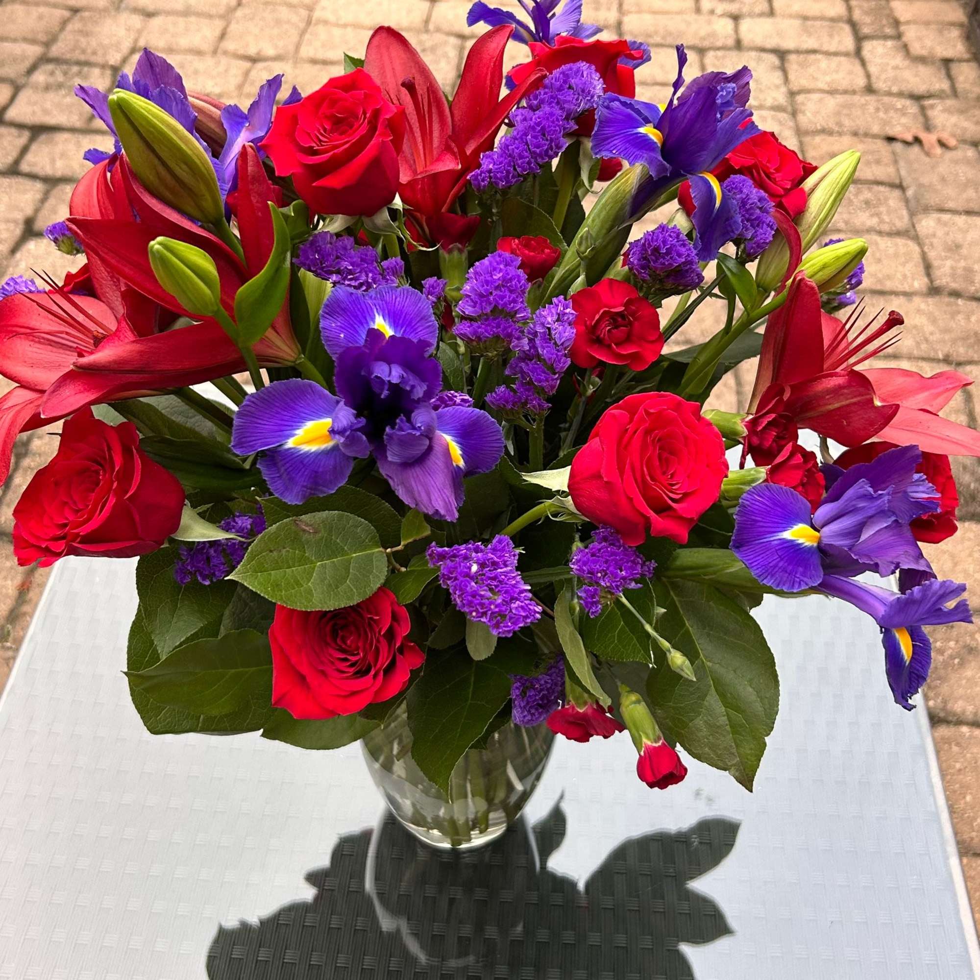 This dreamy jewel toned bouquet combines bold color and eye catching texture