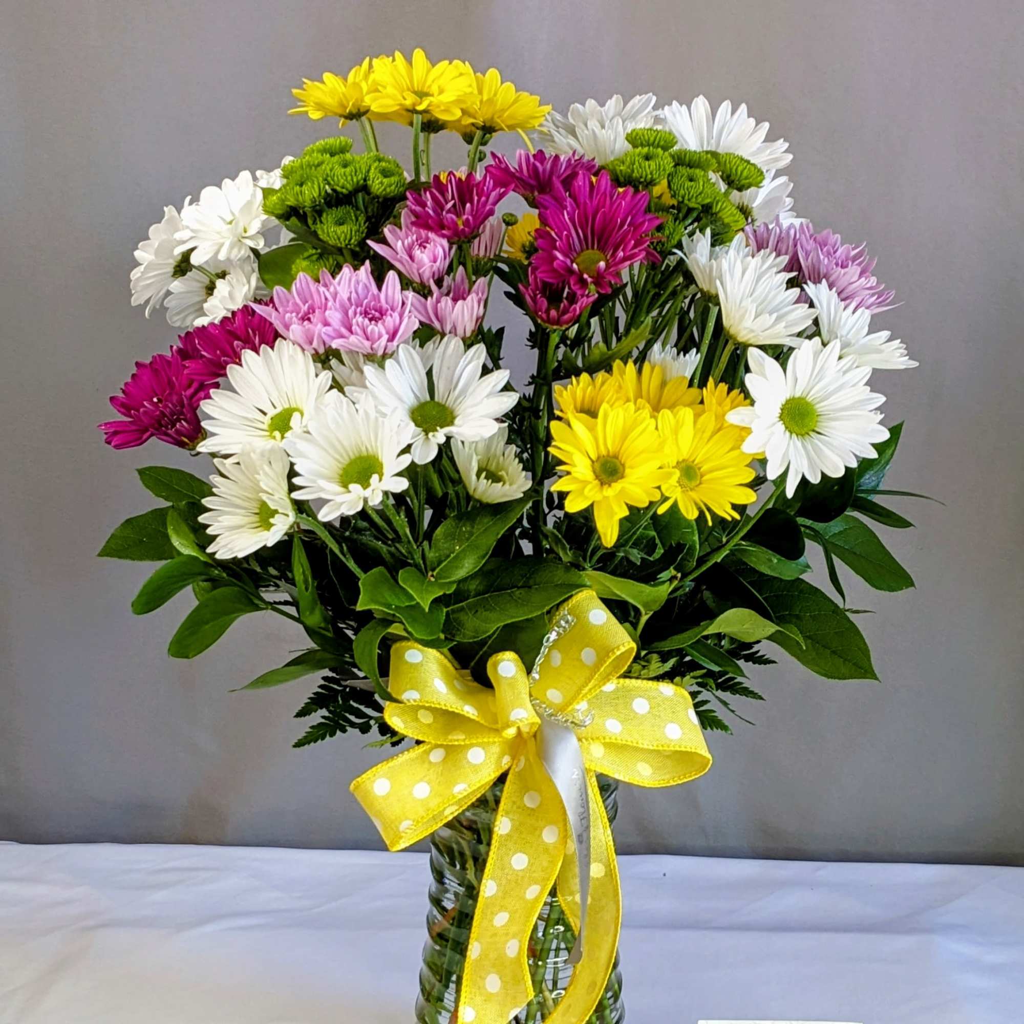 Brighten any space with this stunning Daisy Field arrangement, exclusively crafted with