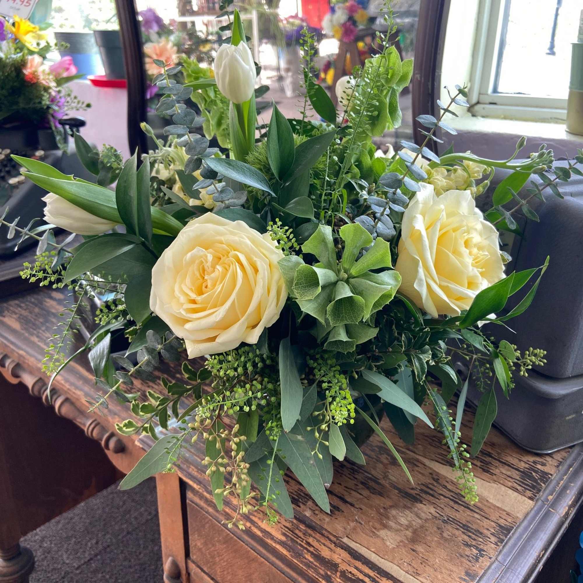 A beautiful St. Patrick's Day mix of Candlelight Roses, White Tulips, Bells