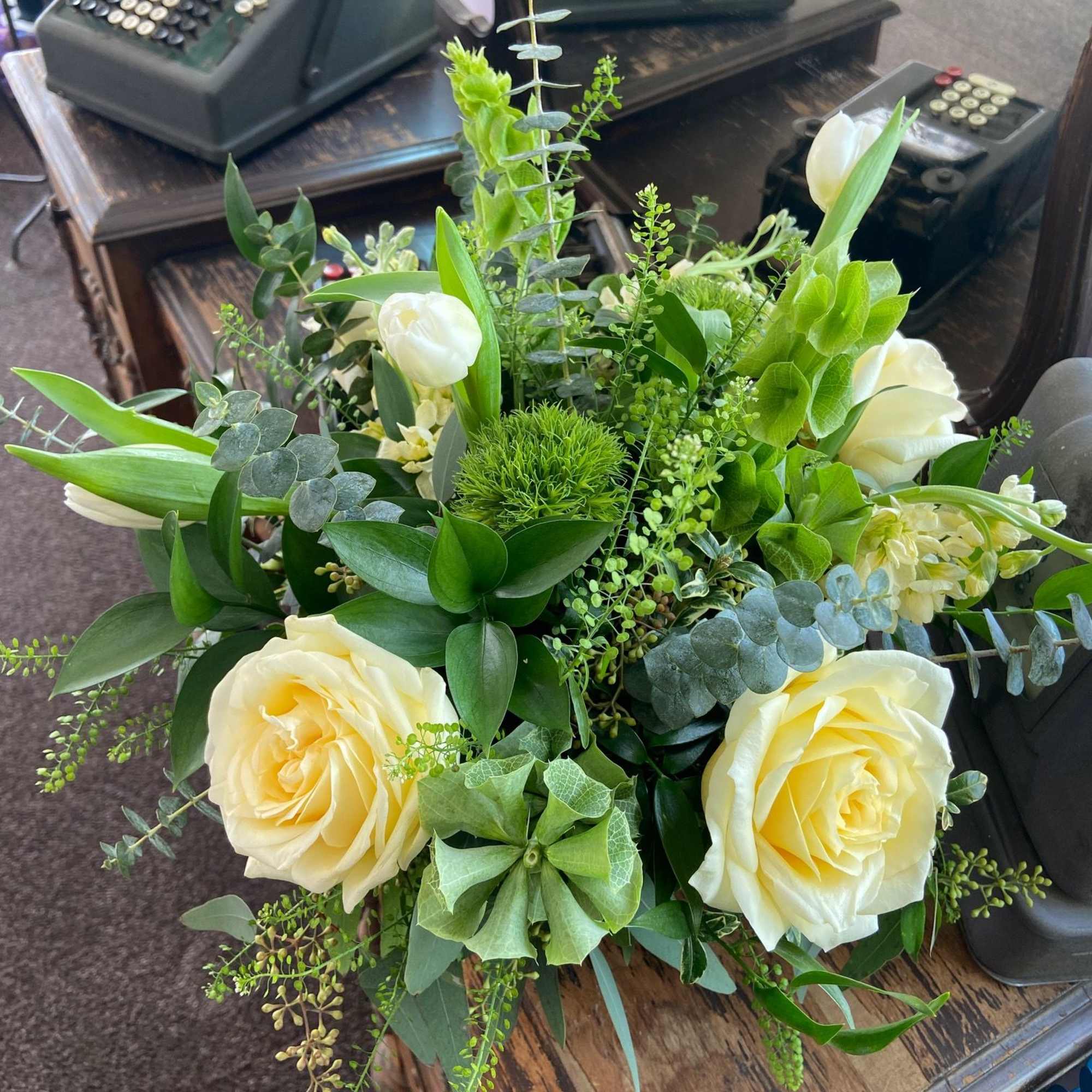 A beautiful St. Patrick's Day mix of Candlelight Roses, White Tulips, Bells