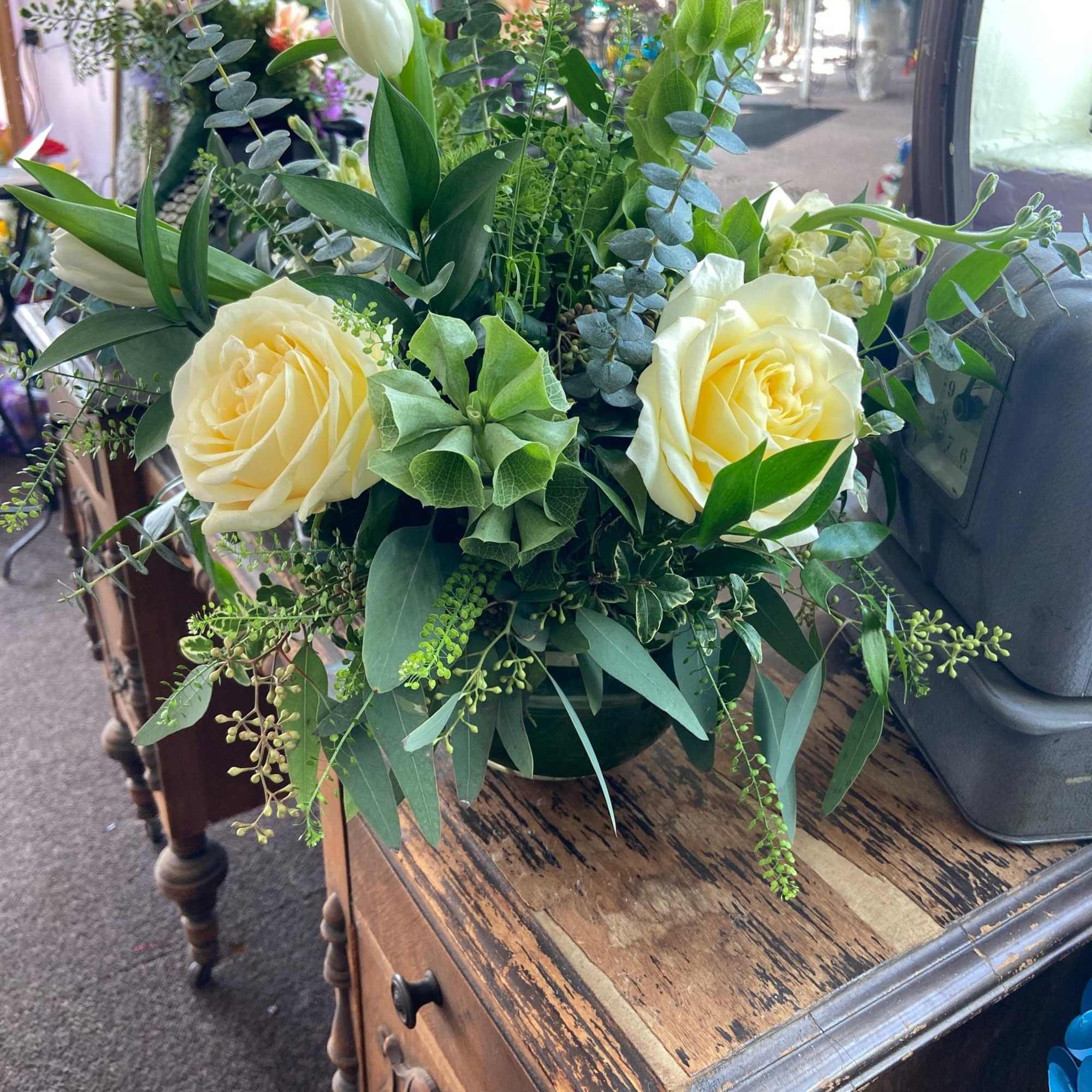 A beautiful St. Patrick's Day mix of Candlelight Roses, White Tulips, Bells