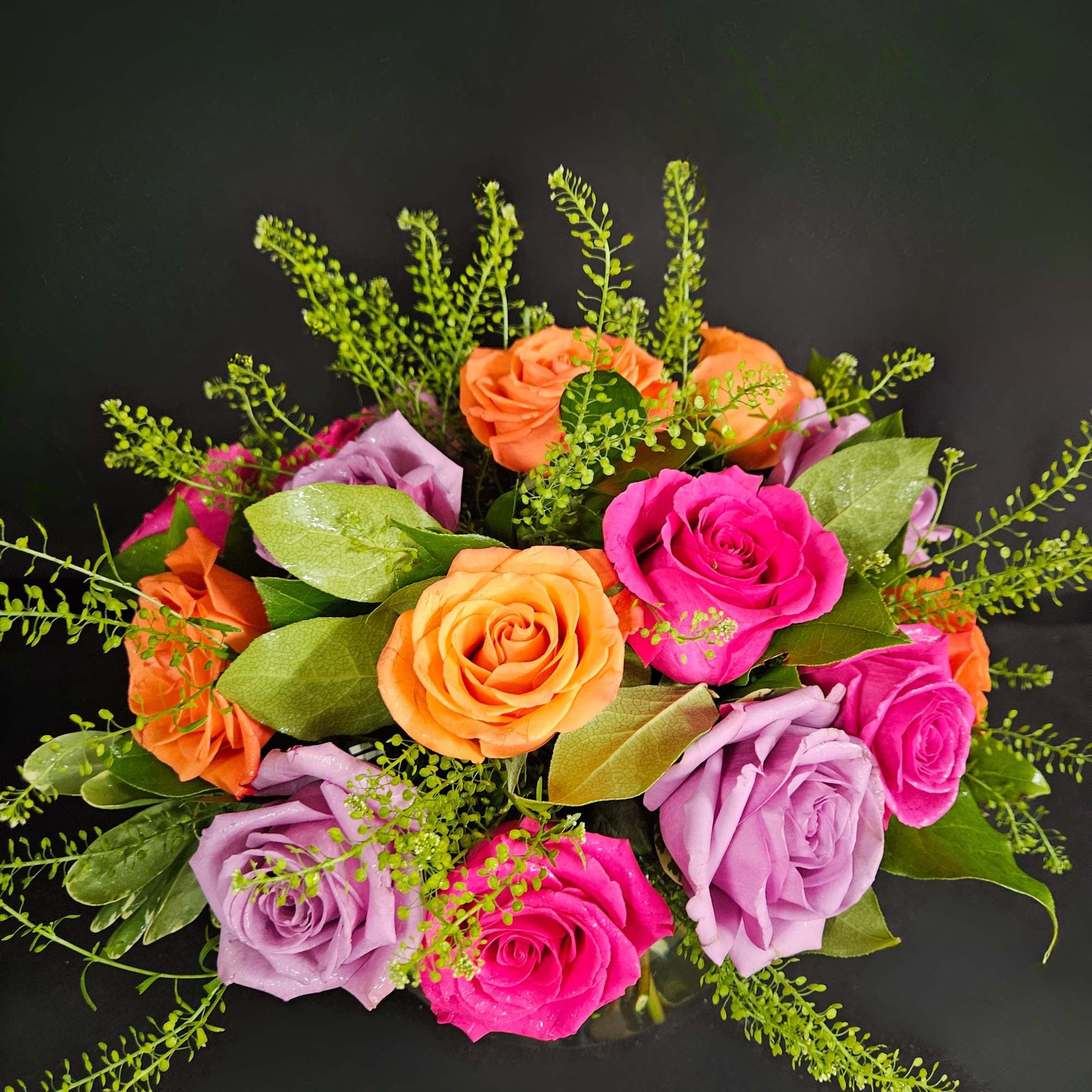 A lovely bowl of colorful roses brightens and lifts any room (and