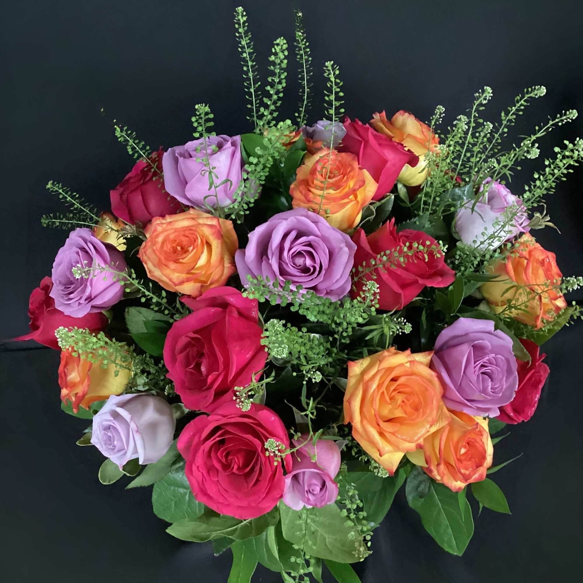 A lovely bowl of colorful roses brightens and lifts any room (and