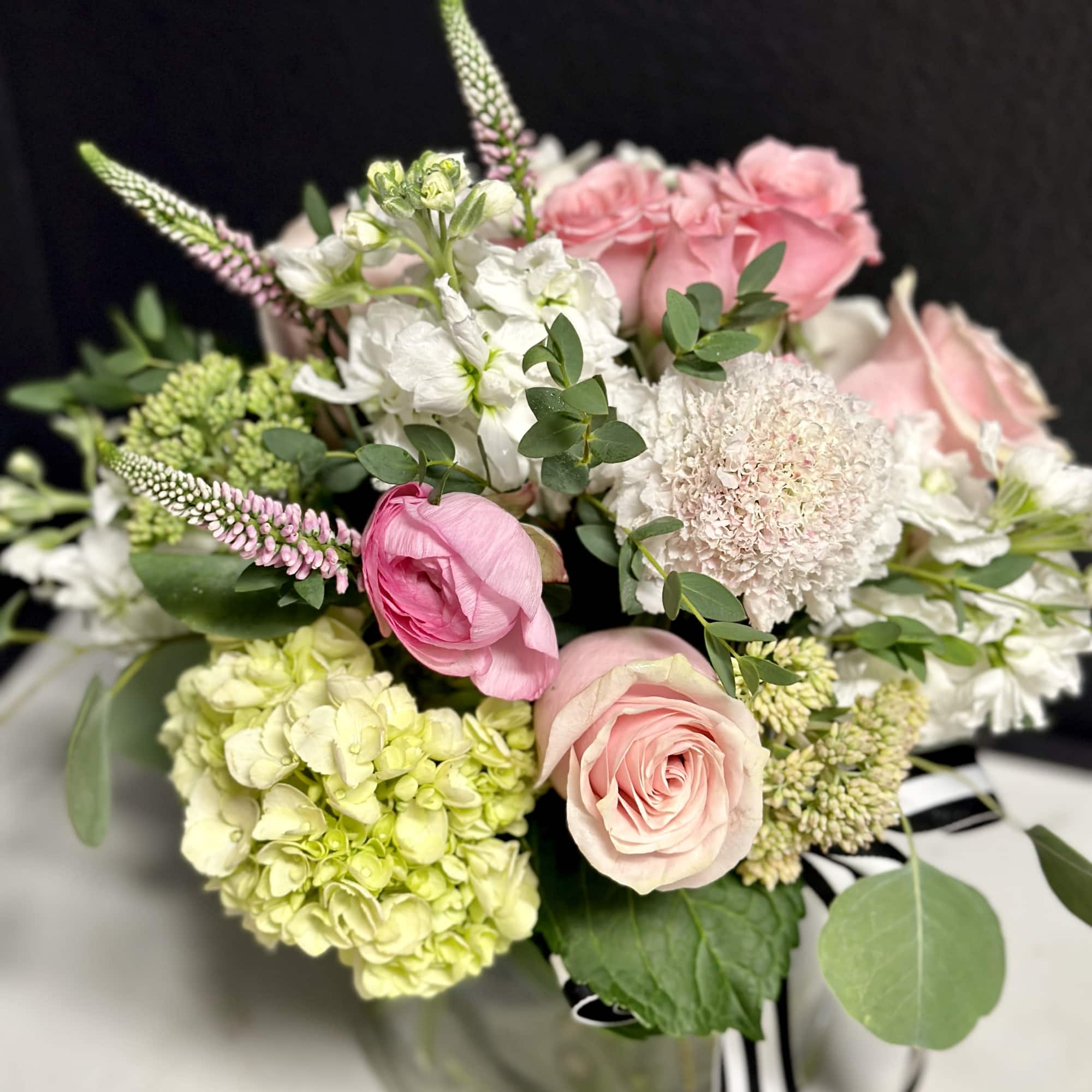 Our softest pink seasonal mix, arranged low and dense in our signature