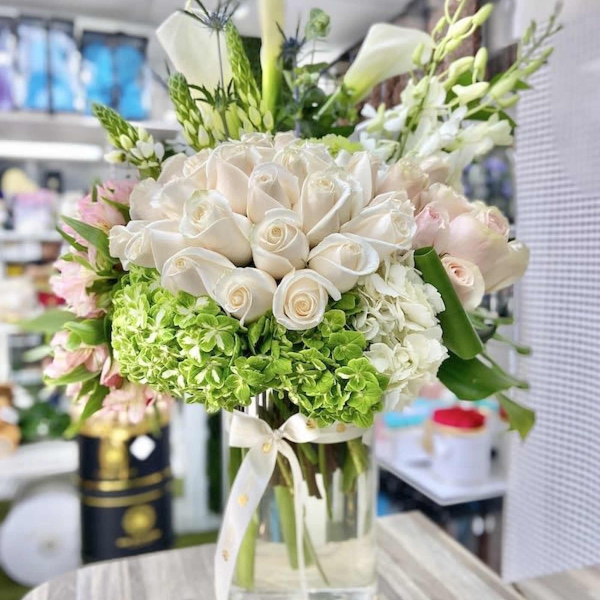 Amore Eterno Roses Bouquet: 3 doz. roses, hydrangeas, fillers, greens, and orchids