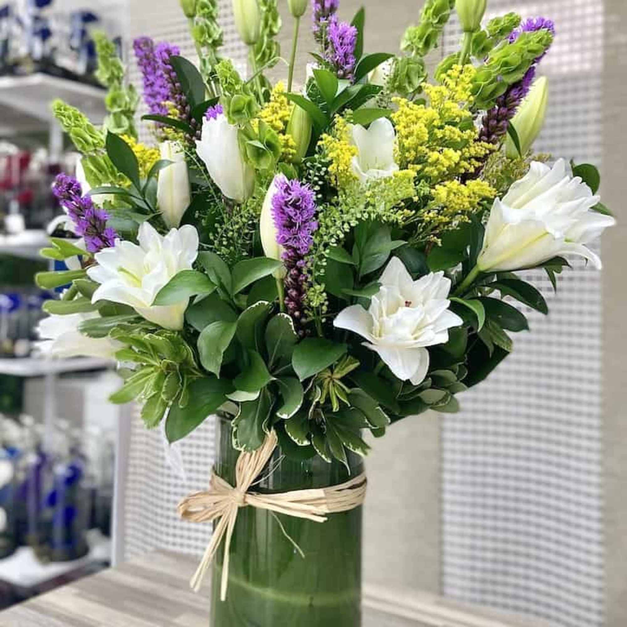 Lilies Splash Bouquet: Beautiful white lilies arrangement accented with greens, liatris, fillers