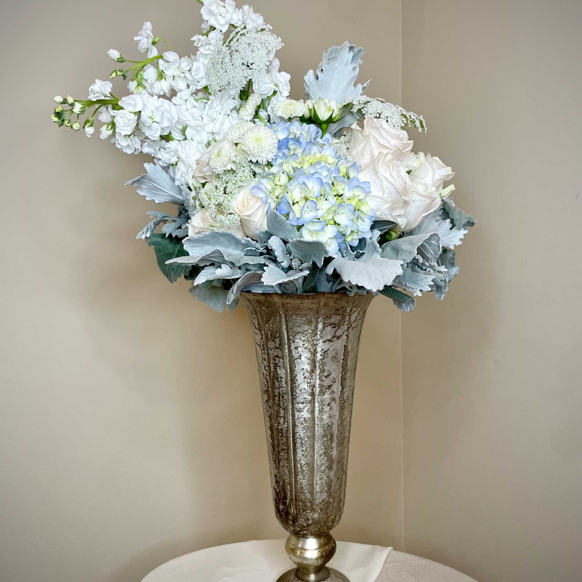Designed as an extension of the Serenity Bouquet, this arrangement stands tall