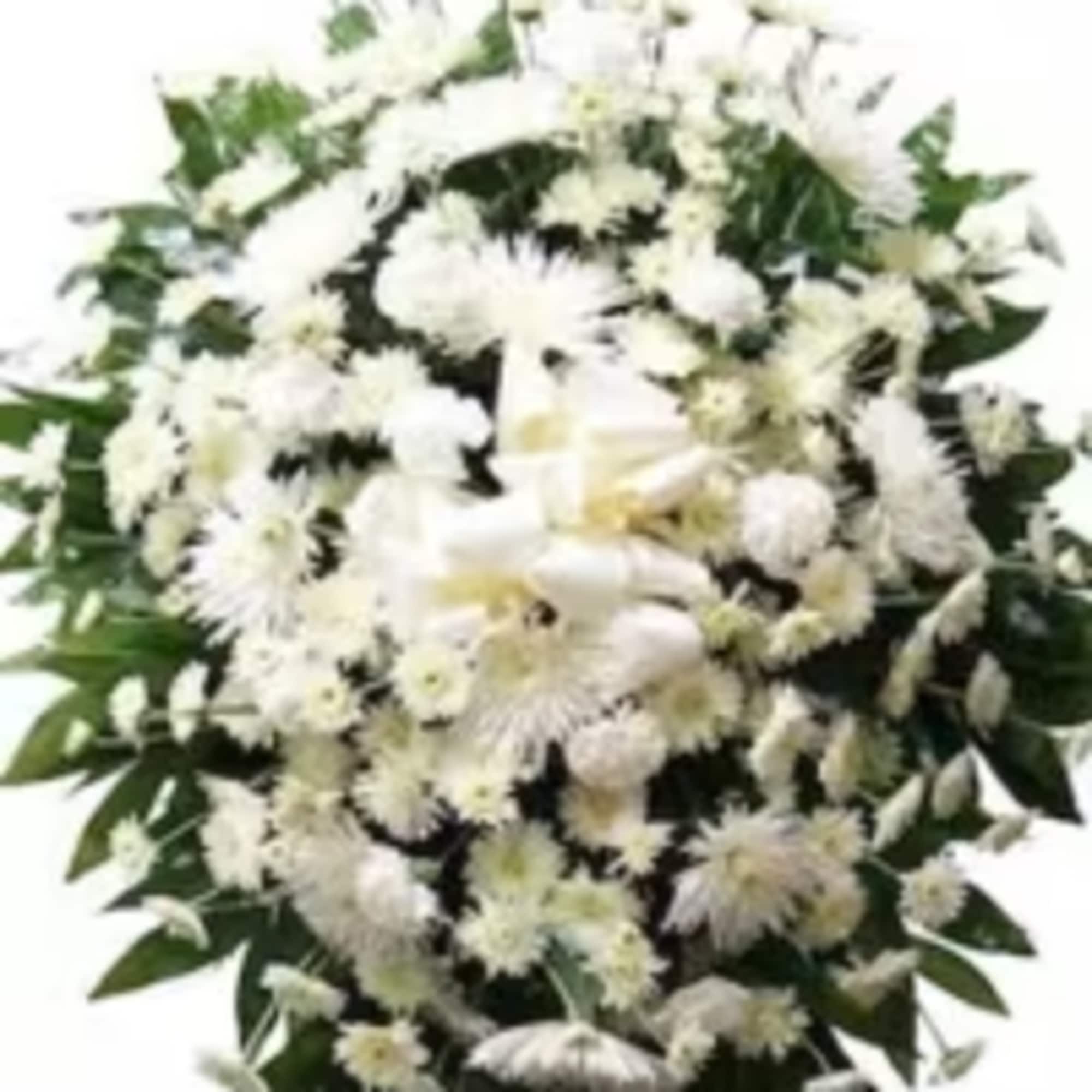 A timeless and elegant standing sympathy spray designed with lush fresh greenery