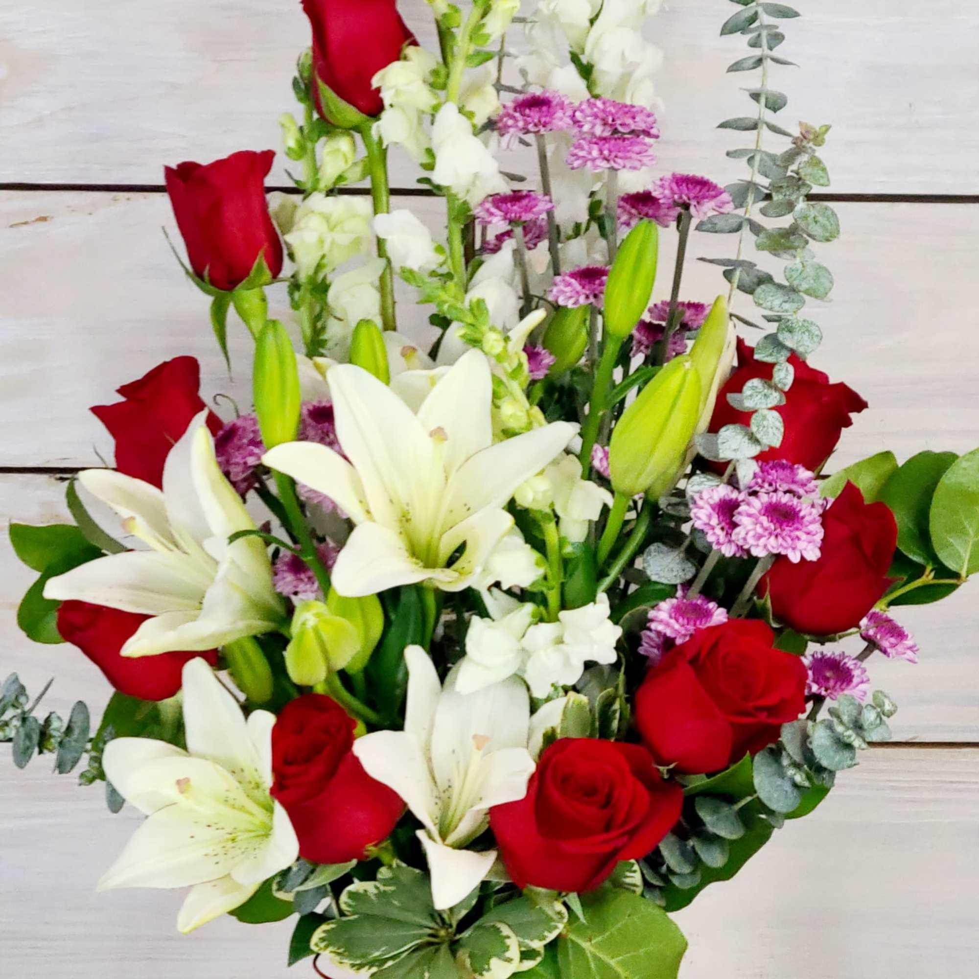Ignite the flames of your love with this red rose arrangement. A