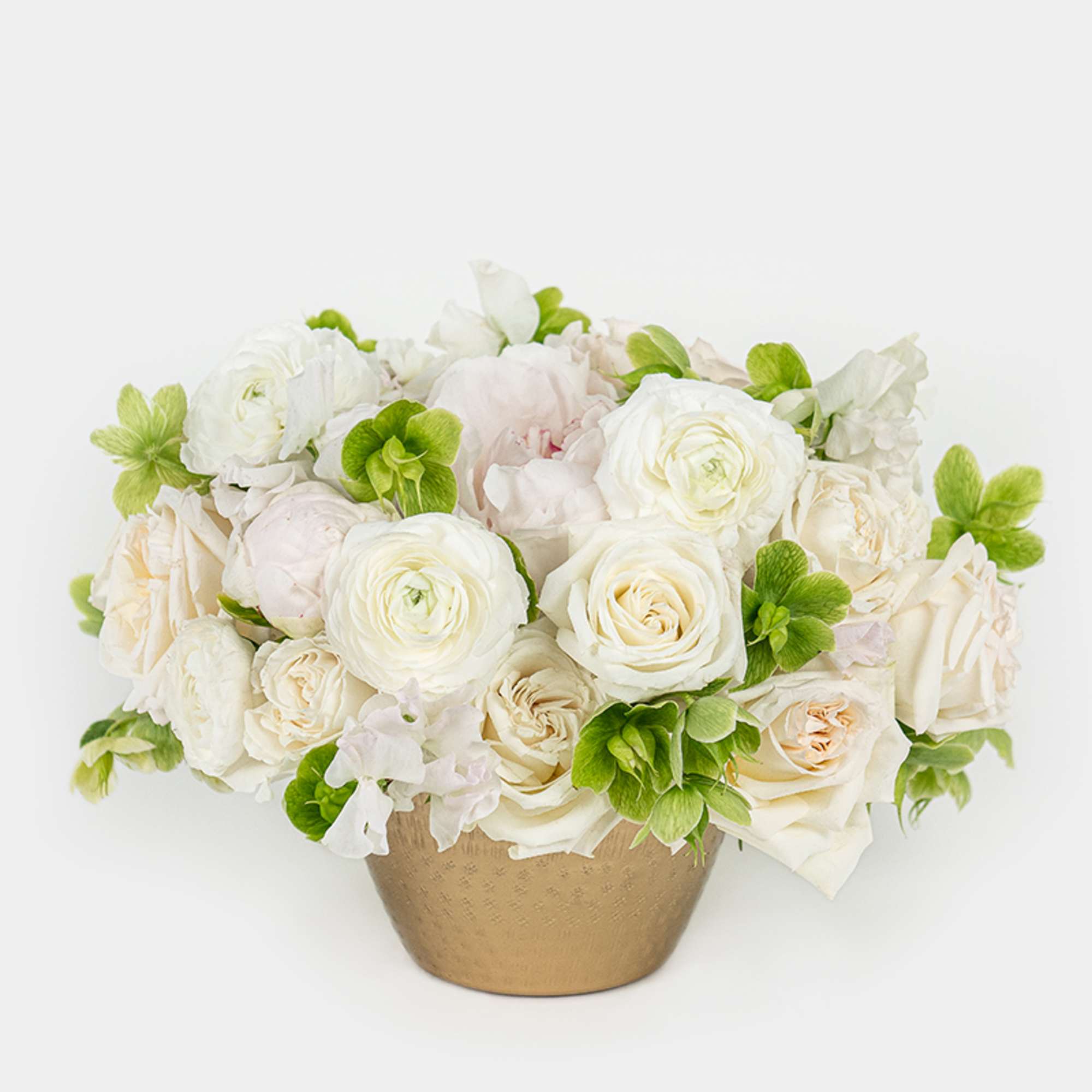 Structured yet effortlessly chic, this monochrome arrangement of roses, ranunculus, sweet peas