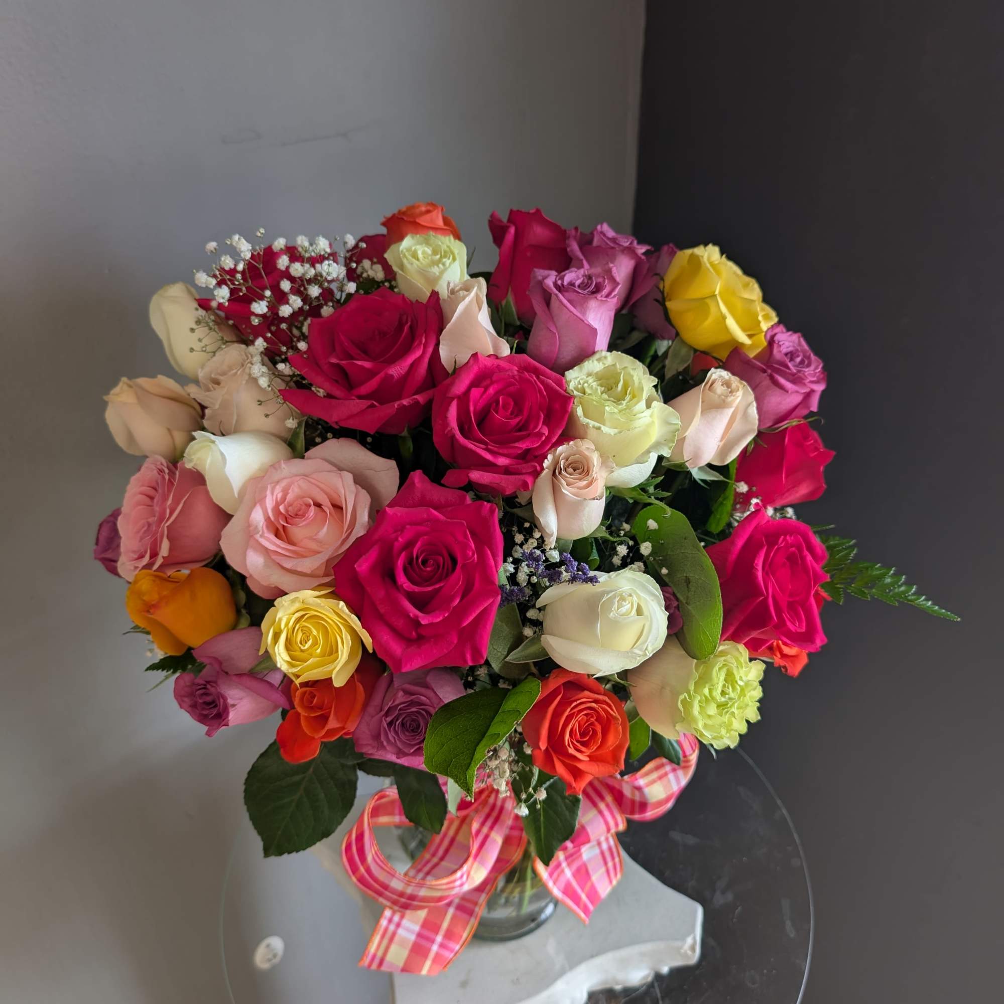 An impressive arrangement of 2, 3 or 4 dozen mixed color roses