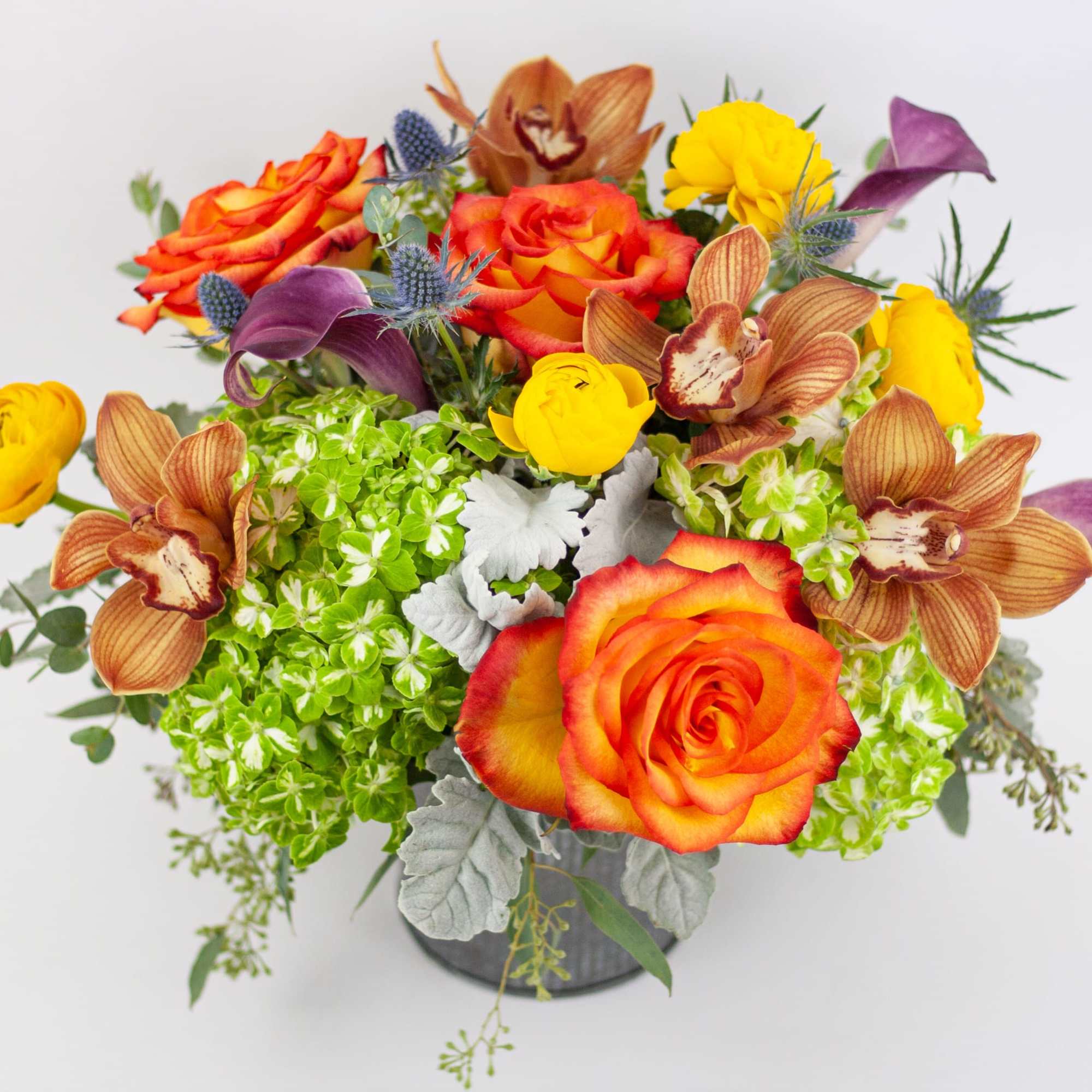 BRIGHT VASE OF FLOWERS WITH CYMBIDIUM ORCHIDS AND ROSES 

Bright, creative and