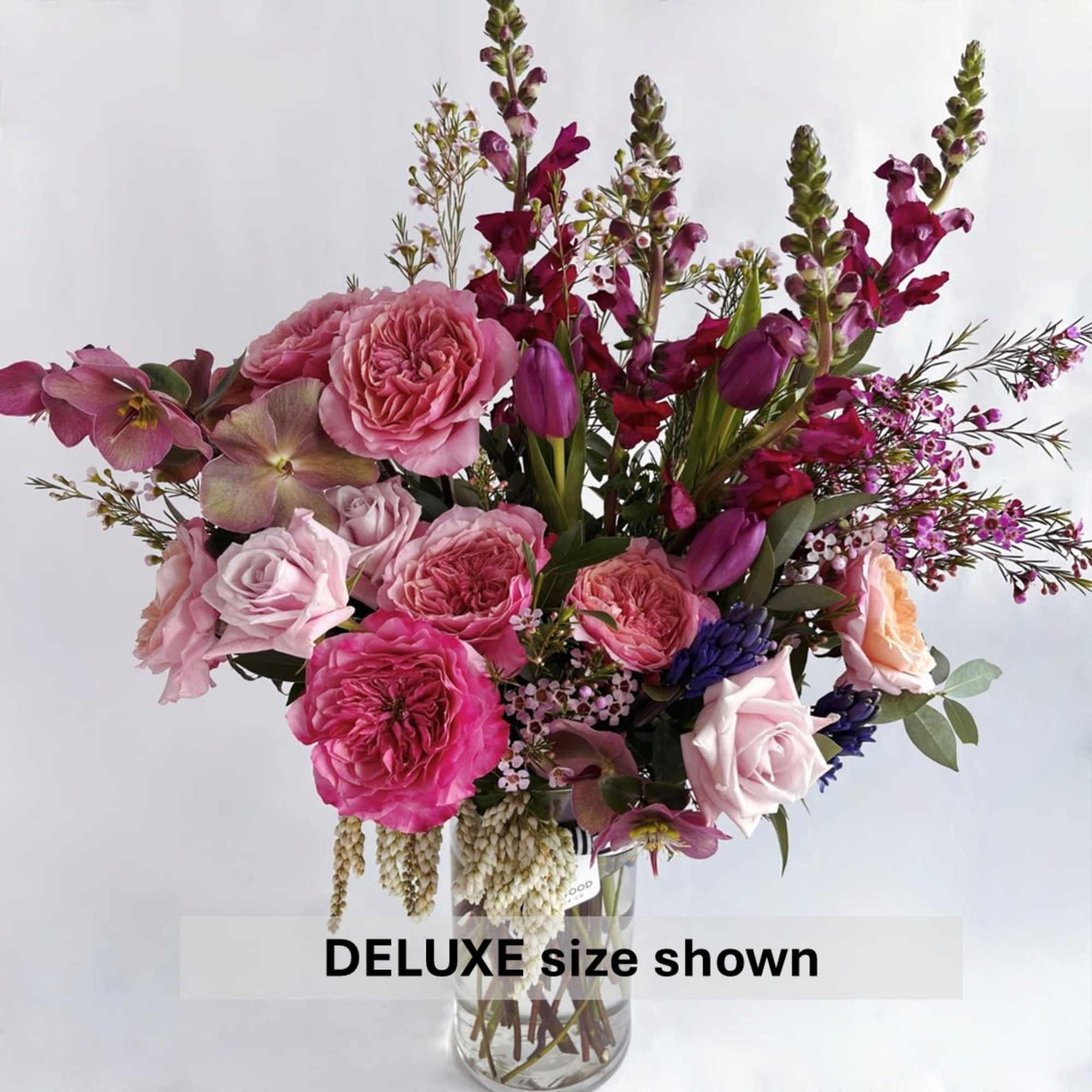 Celebrate strength, beauty, and resilience with this lush arrangement of rich pinks