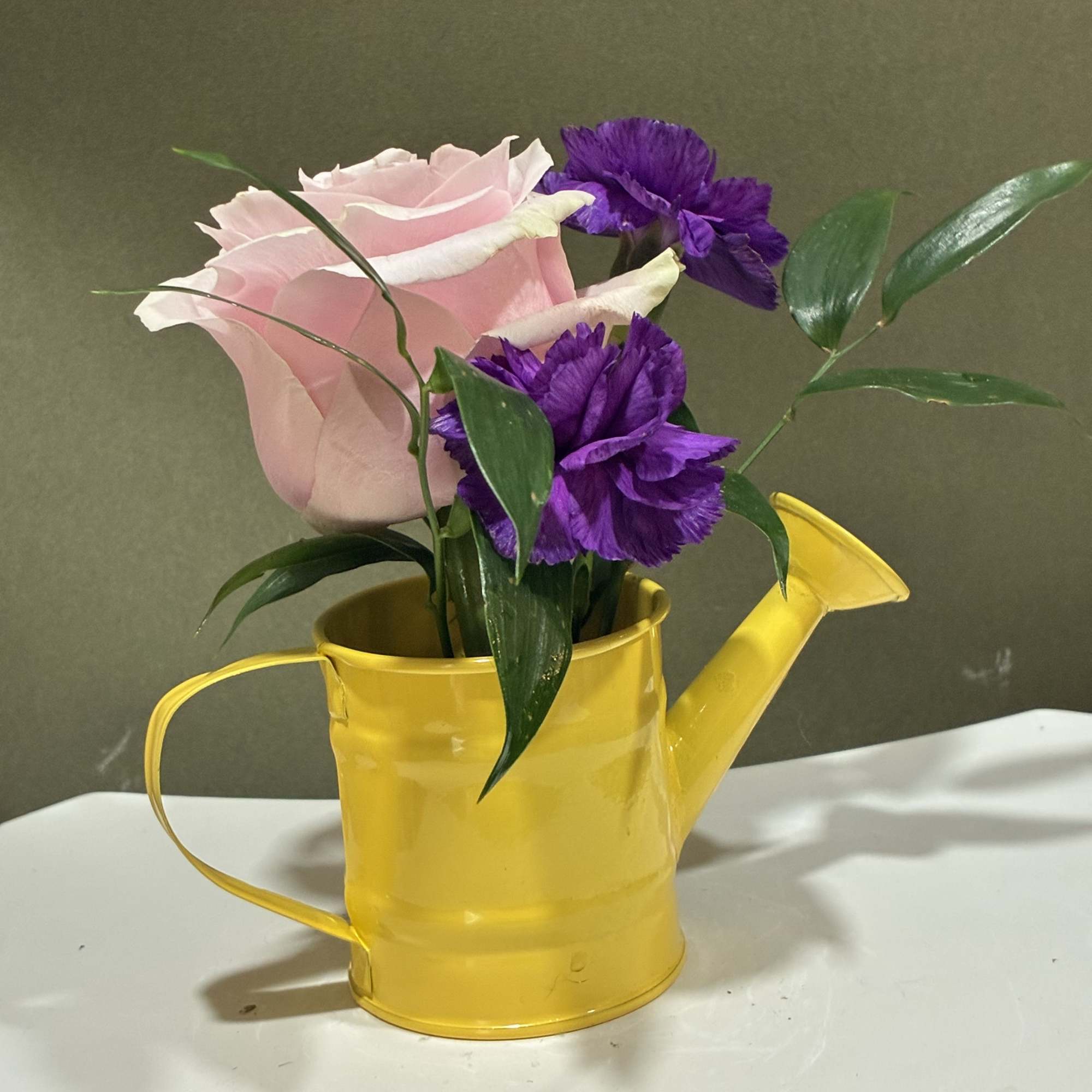 Charming seasonal flowers arranged in classic mason jars create a relaxed, rustic