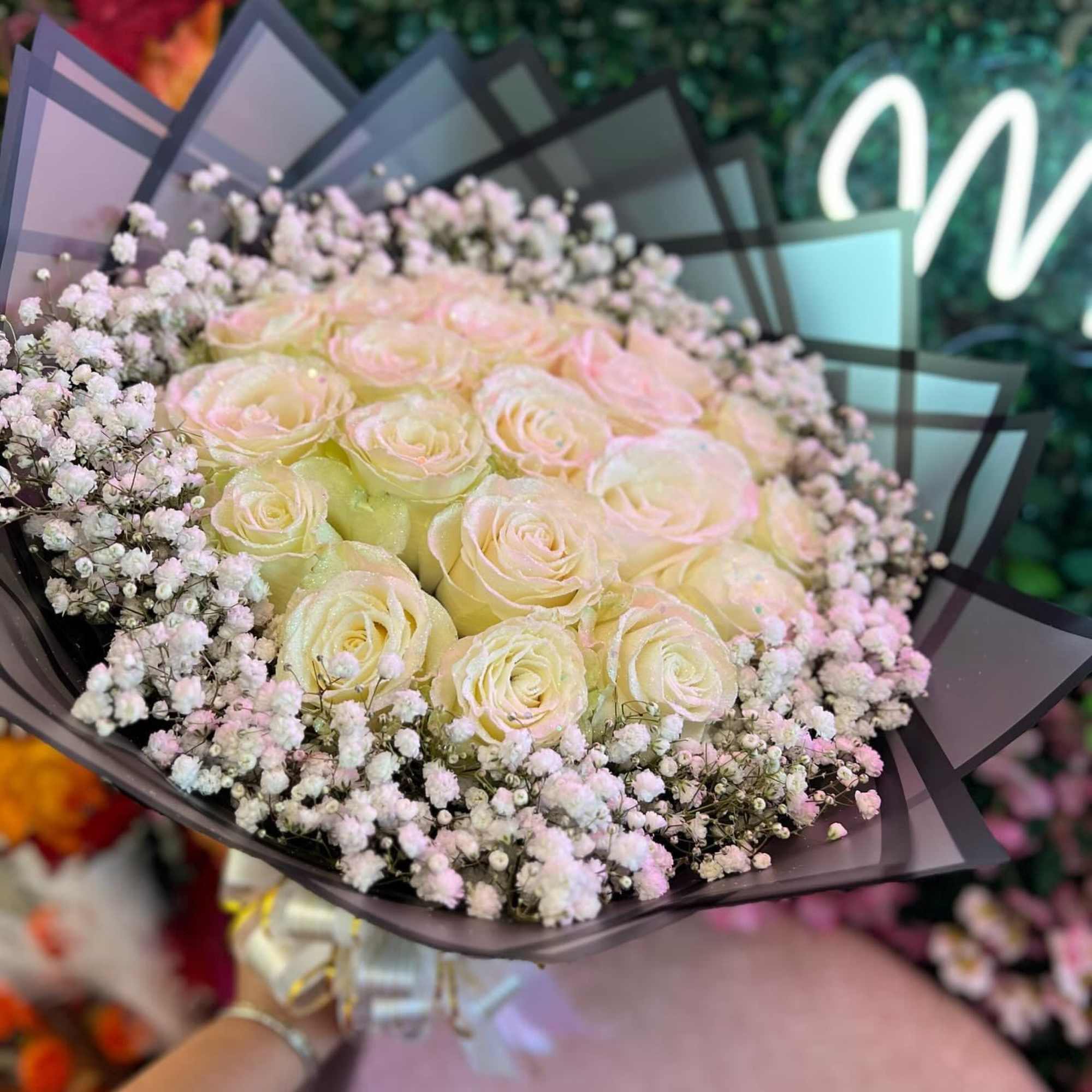 Bouquet of pale pink and cream roses with baby's breath