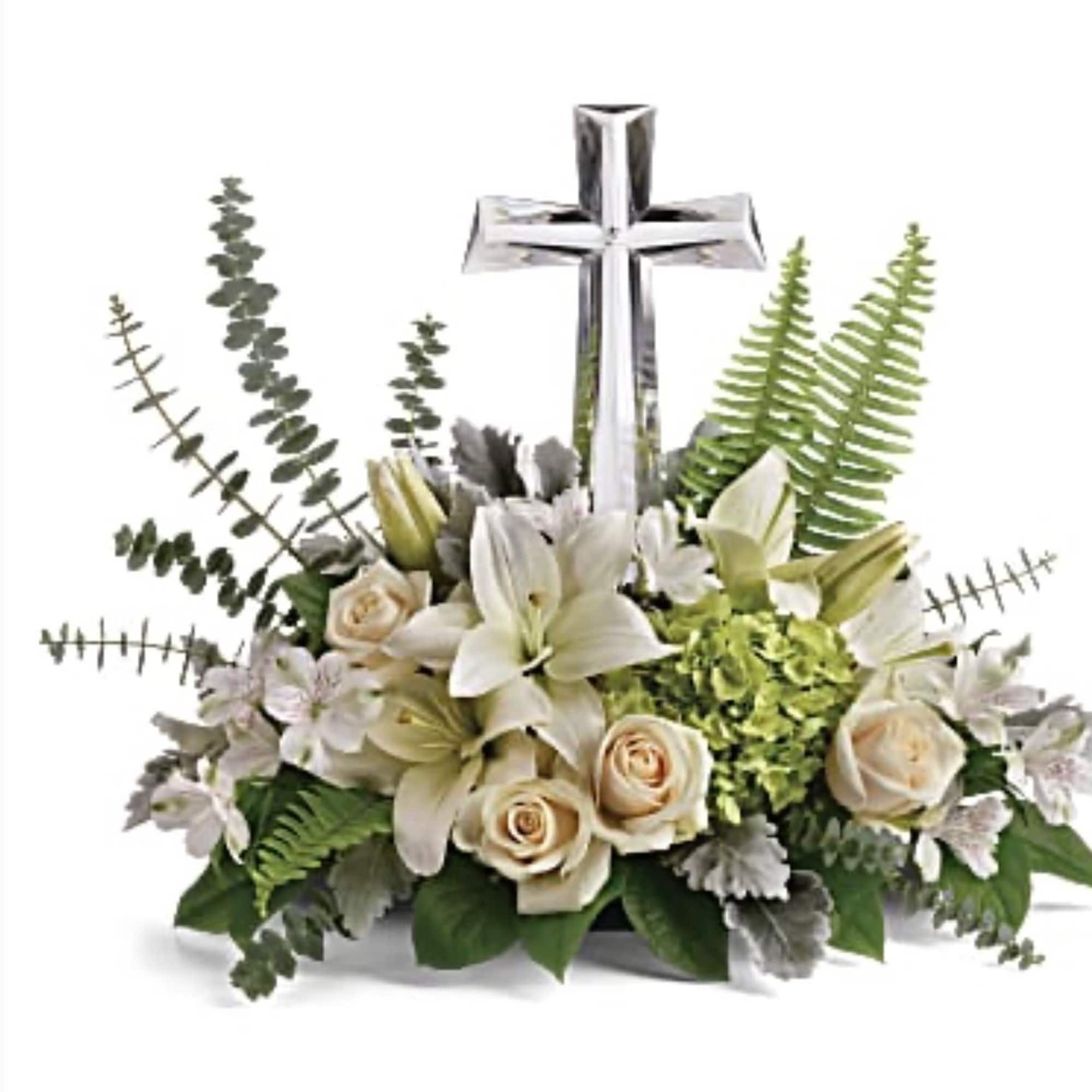 Beautiful variety of seasonal white flowers with a keepsake Crystal Cross. 