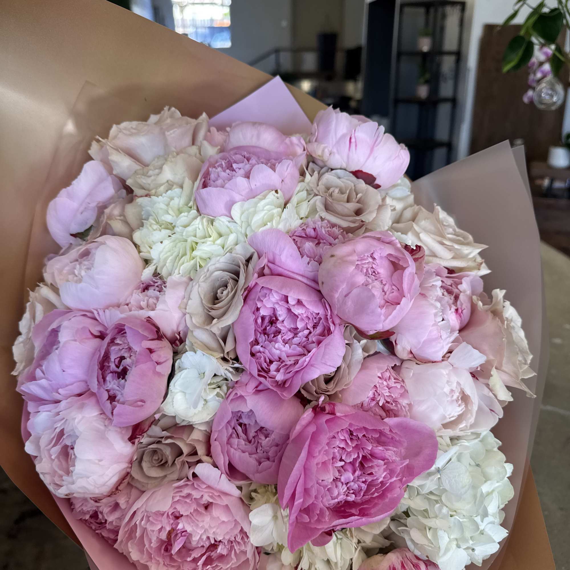 Fresh peony wrapped bouquet. Can be mixed with other textures and greens.