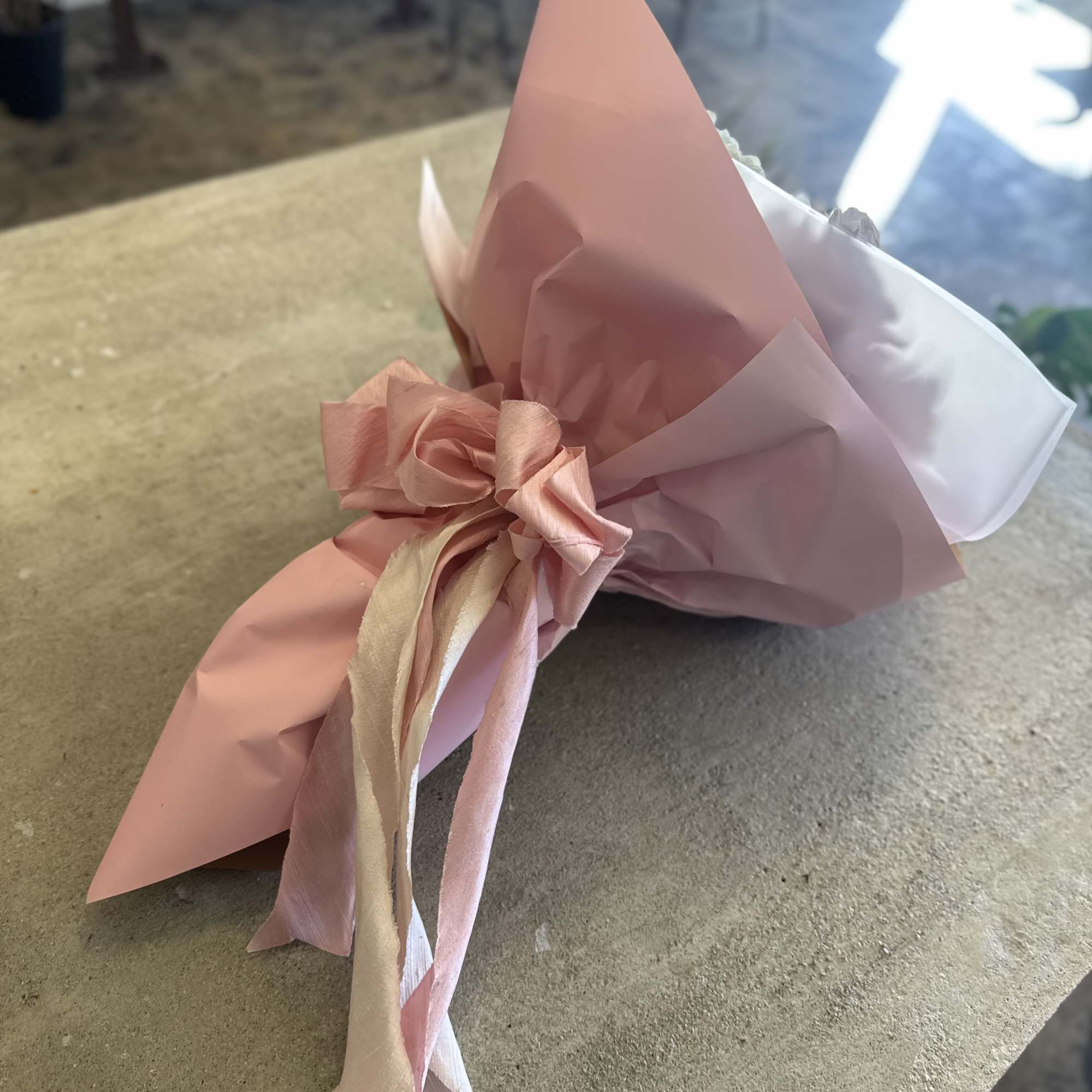 Fresh peony wrapped bouquet. Can be mixed with other textures and greens.