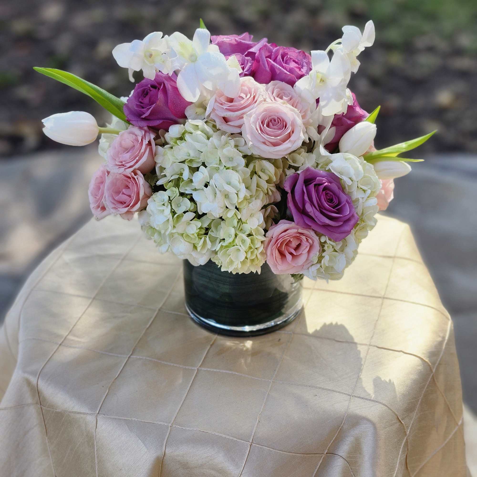 Classic and Beautiful, this large arrangement whispers luxury. Soft pinks, whites and