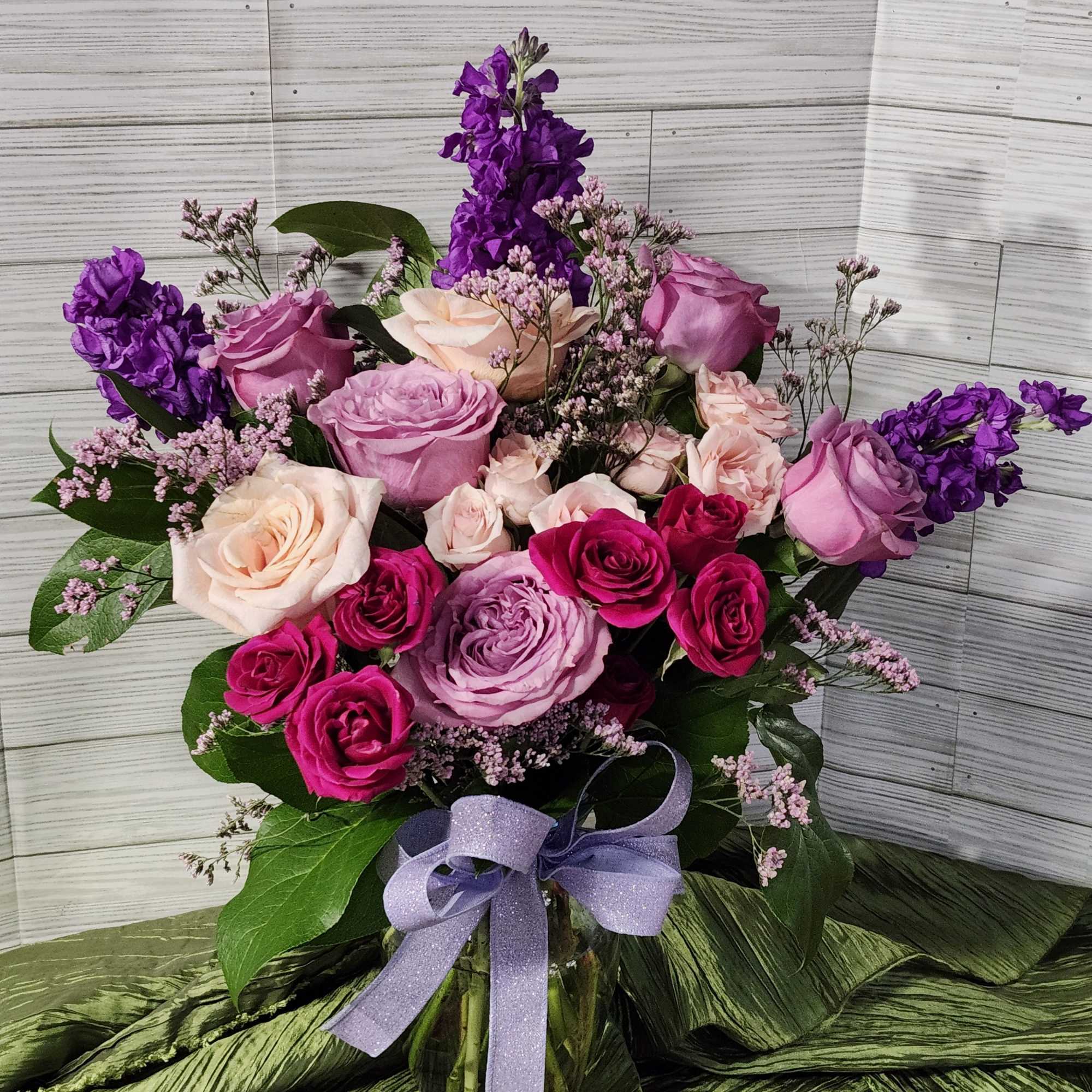 One sided,  Mix flowers of different Valentine colors of pinks, purple