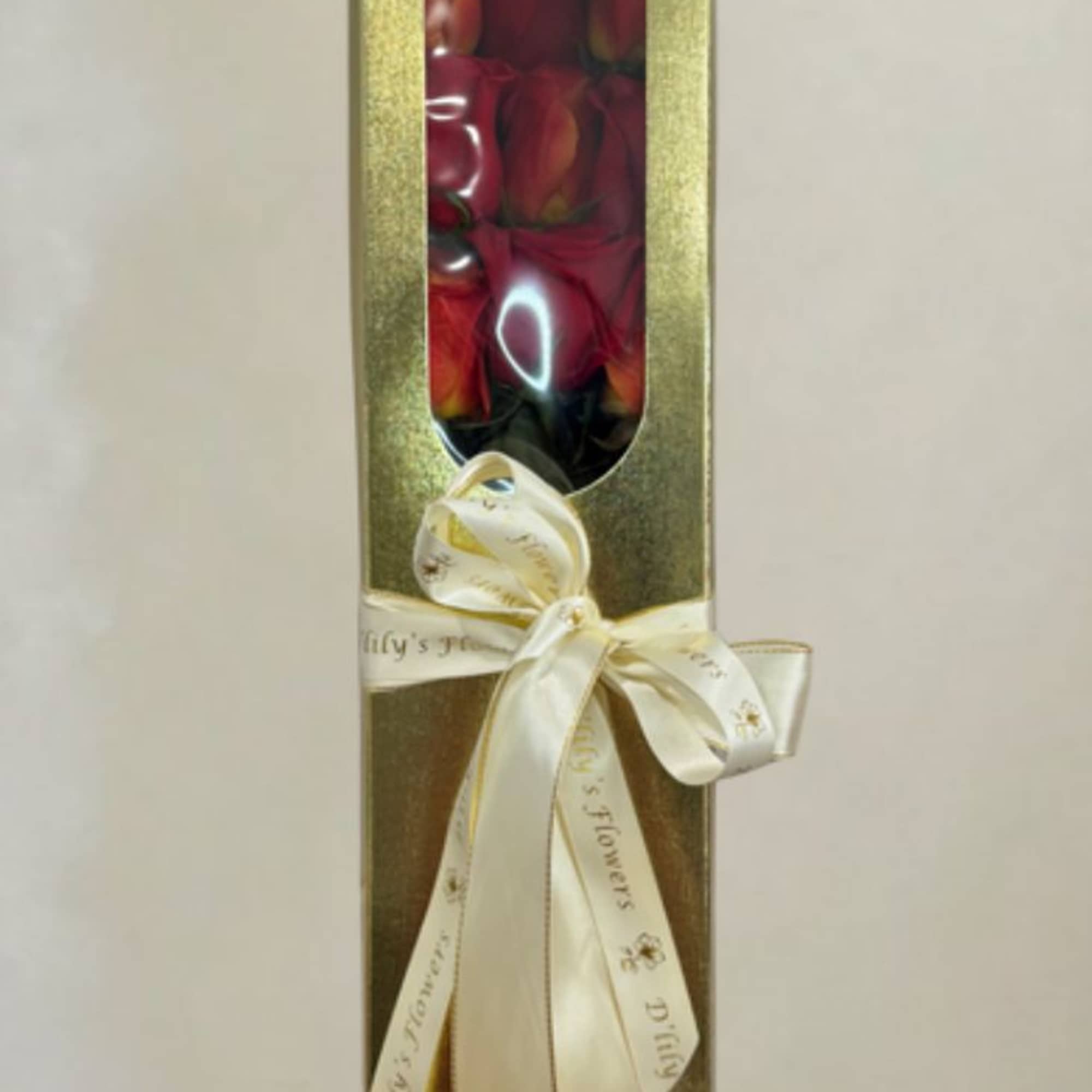 A simple yet elegant dozen roses placed in a box for a