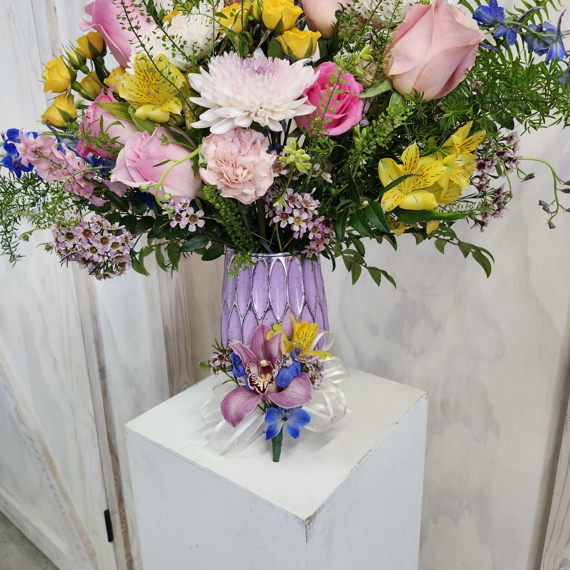 Have your special mom wear a beautiful floral boutanierre of cymbidium orchid