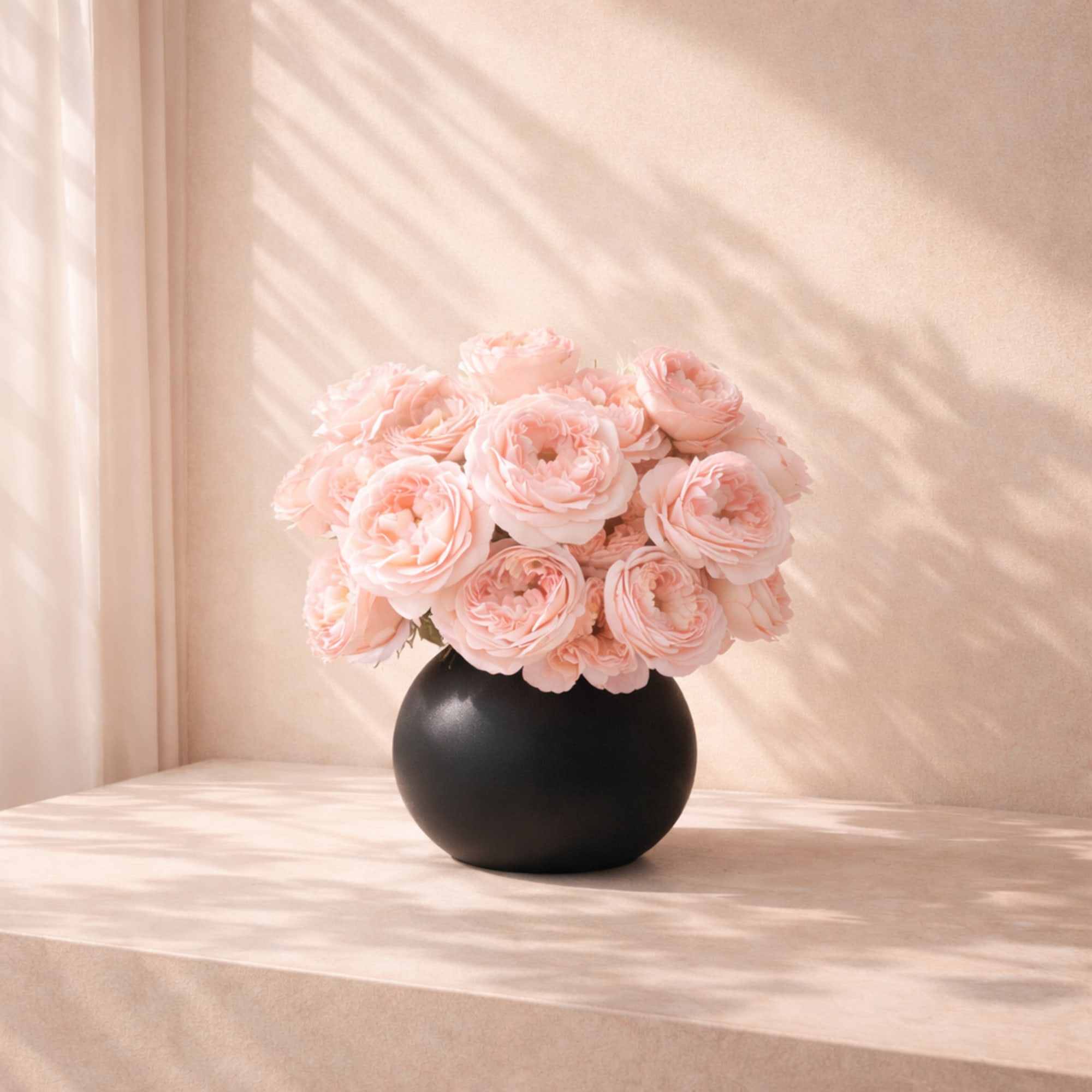 The Blush Garden Rose one side Arrangement features luxurious garden roses arranged