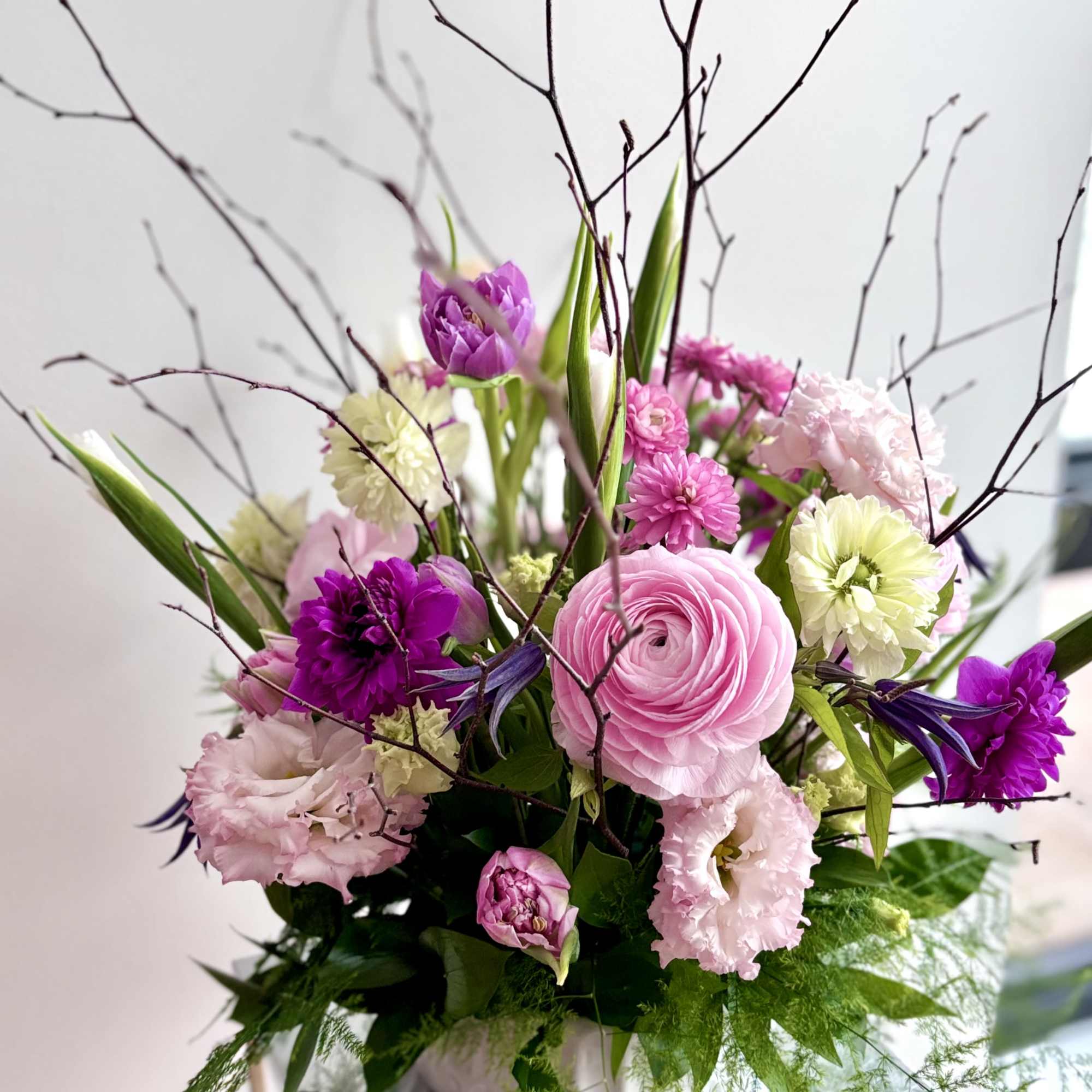 A fresh flower centerpiece for Easter with a rich variety of premium
