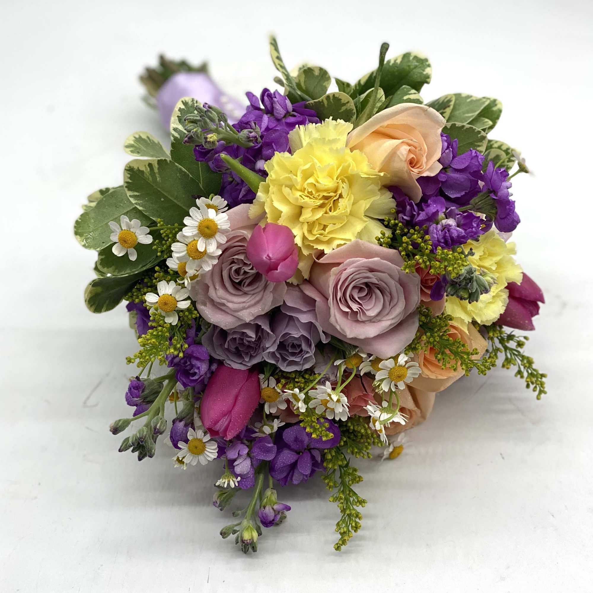 A beautiful mix of soft tones - lavender roses, pale yellow carnations