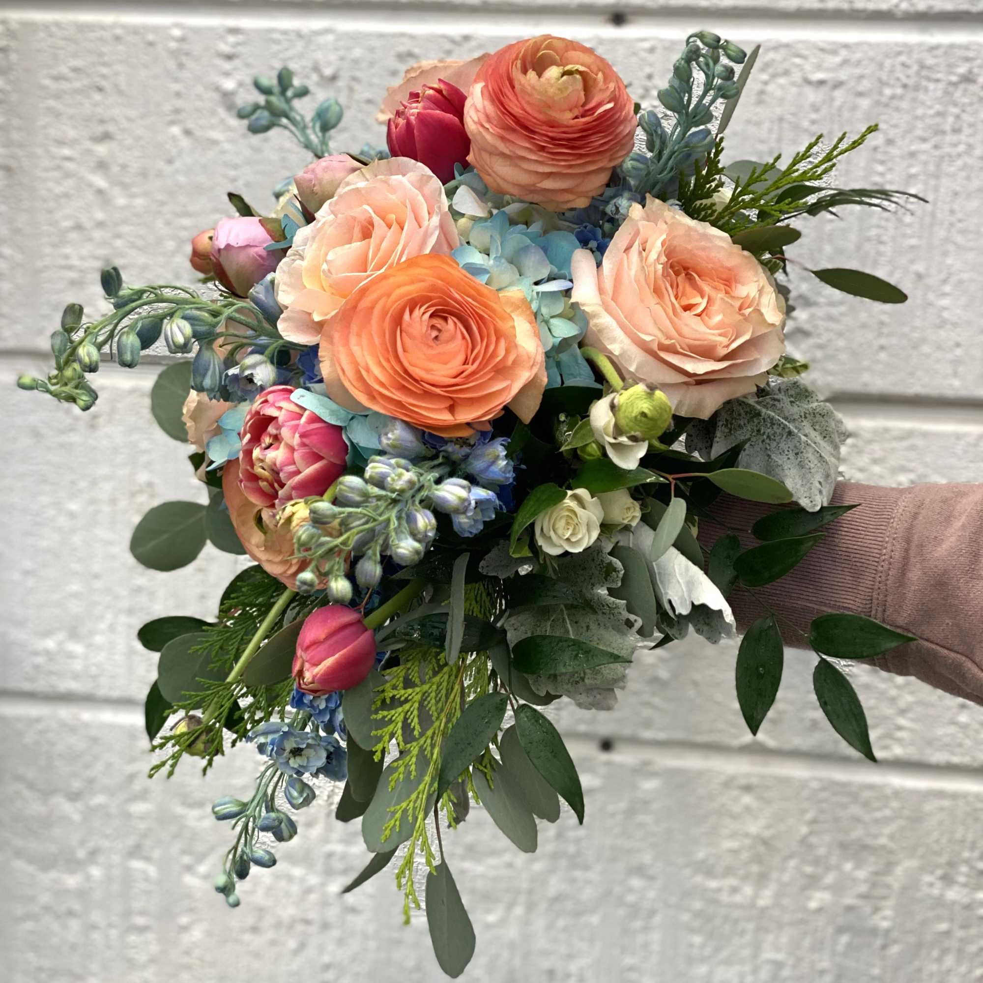 This bouquet is designed in a cascading style. It is made up