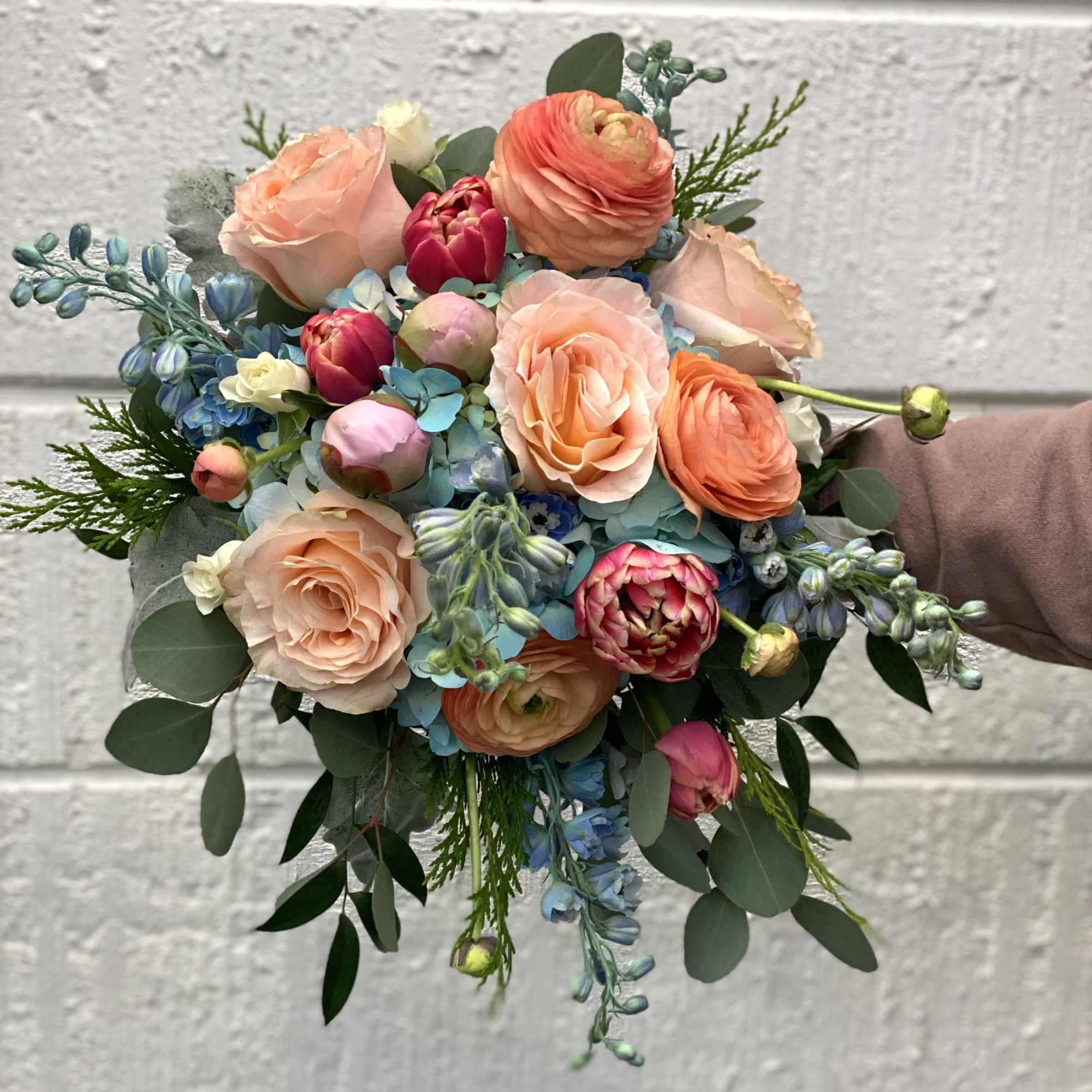 This bouquet is designed in a cascading style. It is made up