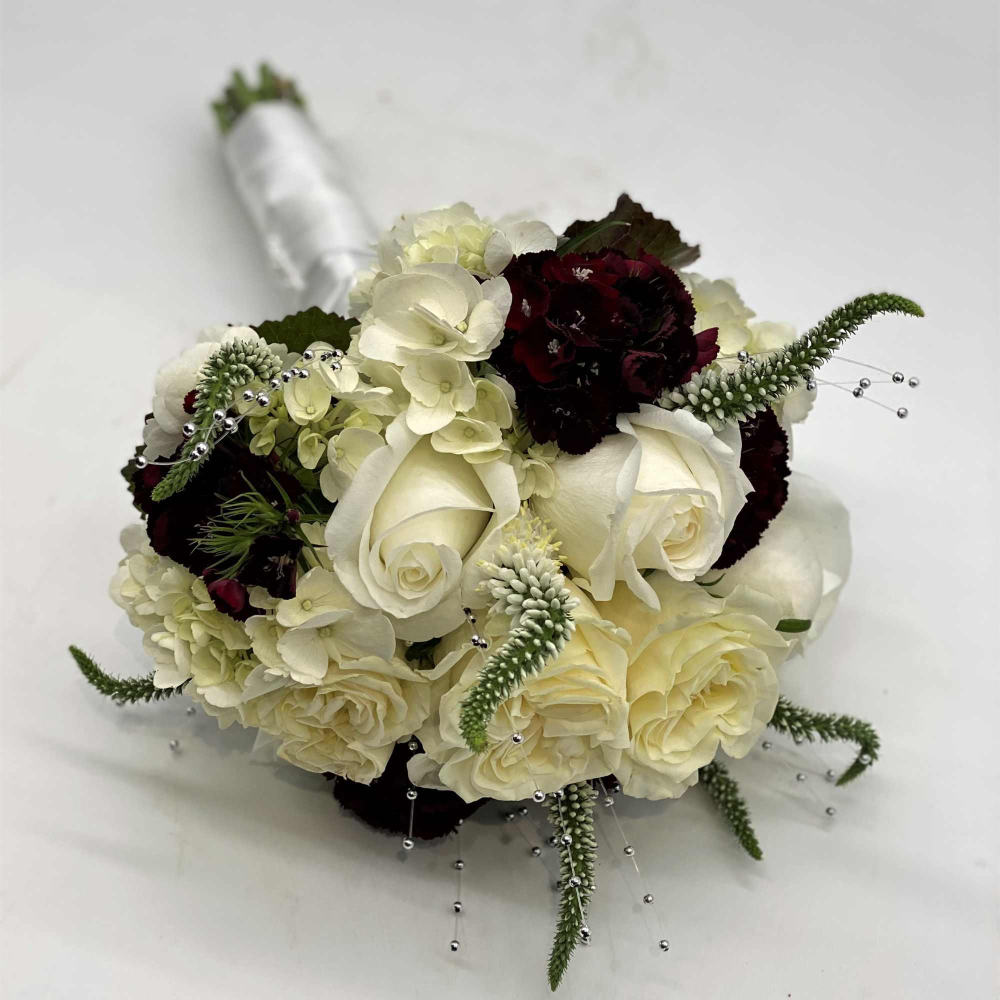 Lush whites, burgundy and pops of silver!