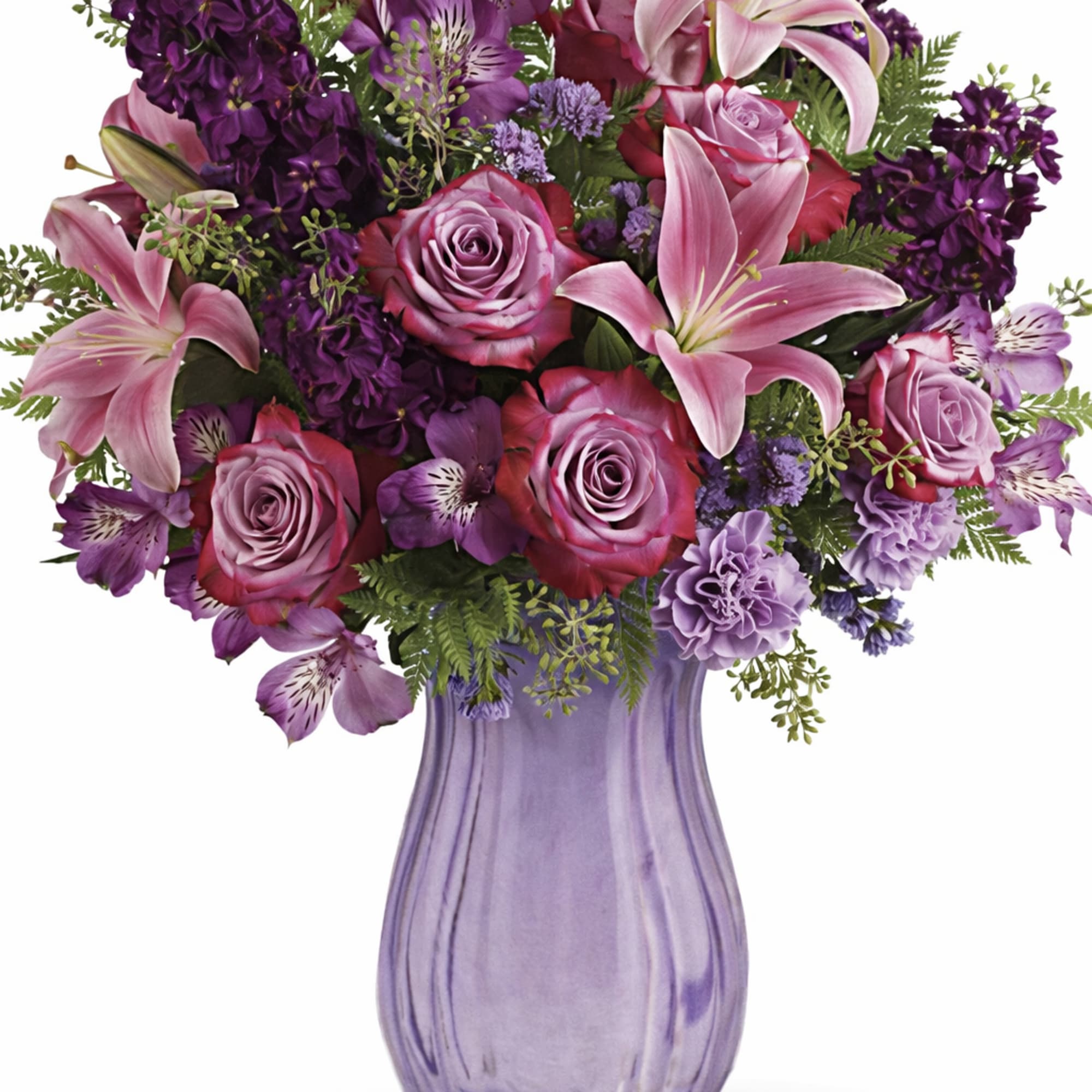 This regal arrangement of lavender roses and pink lilies is naturally breathtaking.