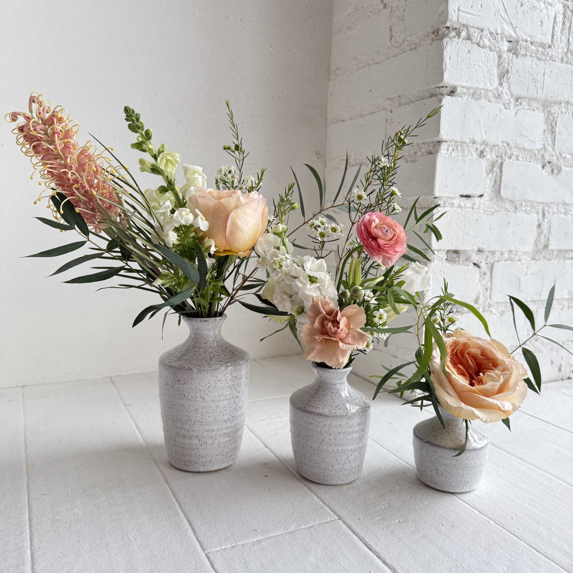 An eclectic mix of mostly peach flowers, with some white flowers in