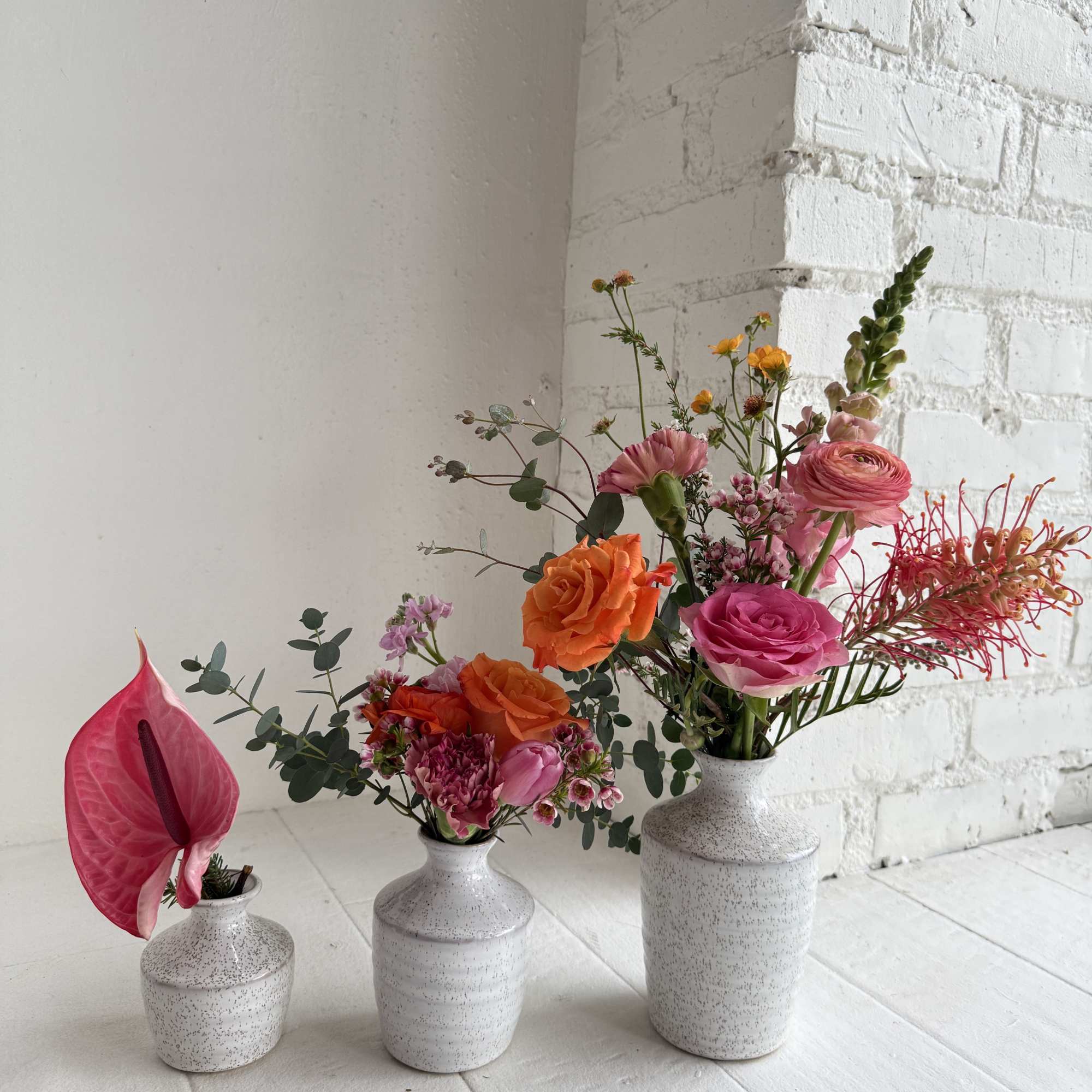 A fun eclectic mix of bright pinks and orange. Arrives in a